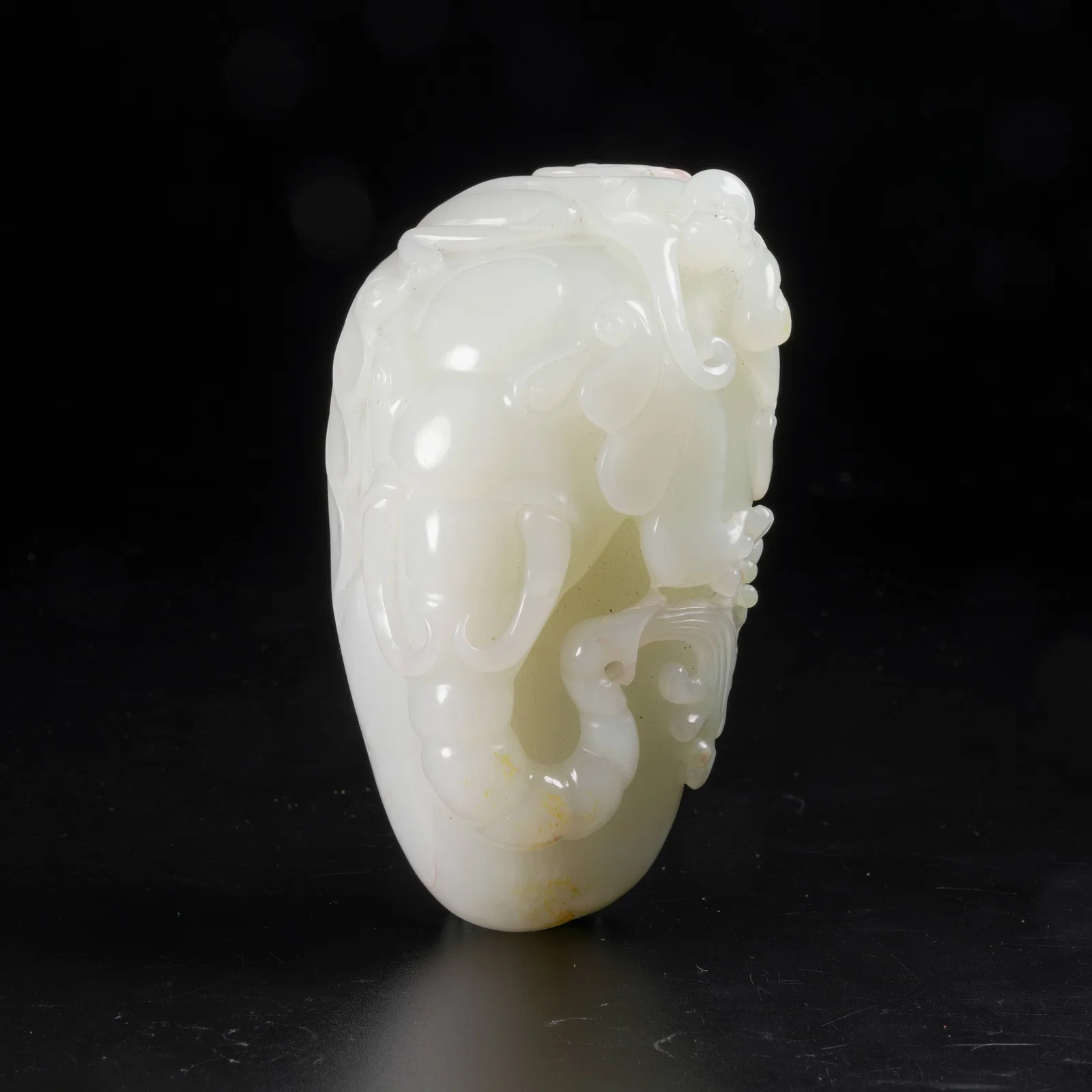 A HETIAN JADE AUSPICIOUS BEAST–PATTERN ORNAMENT