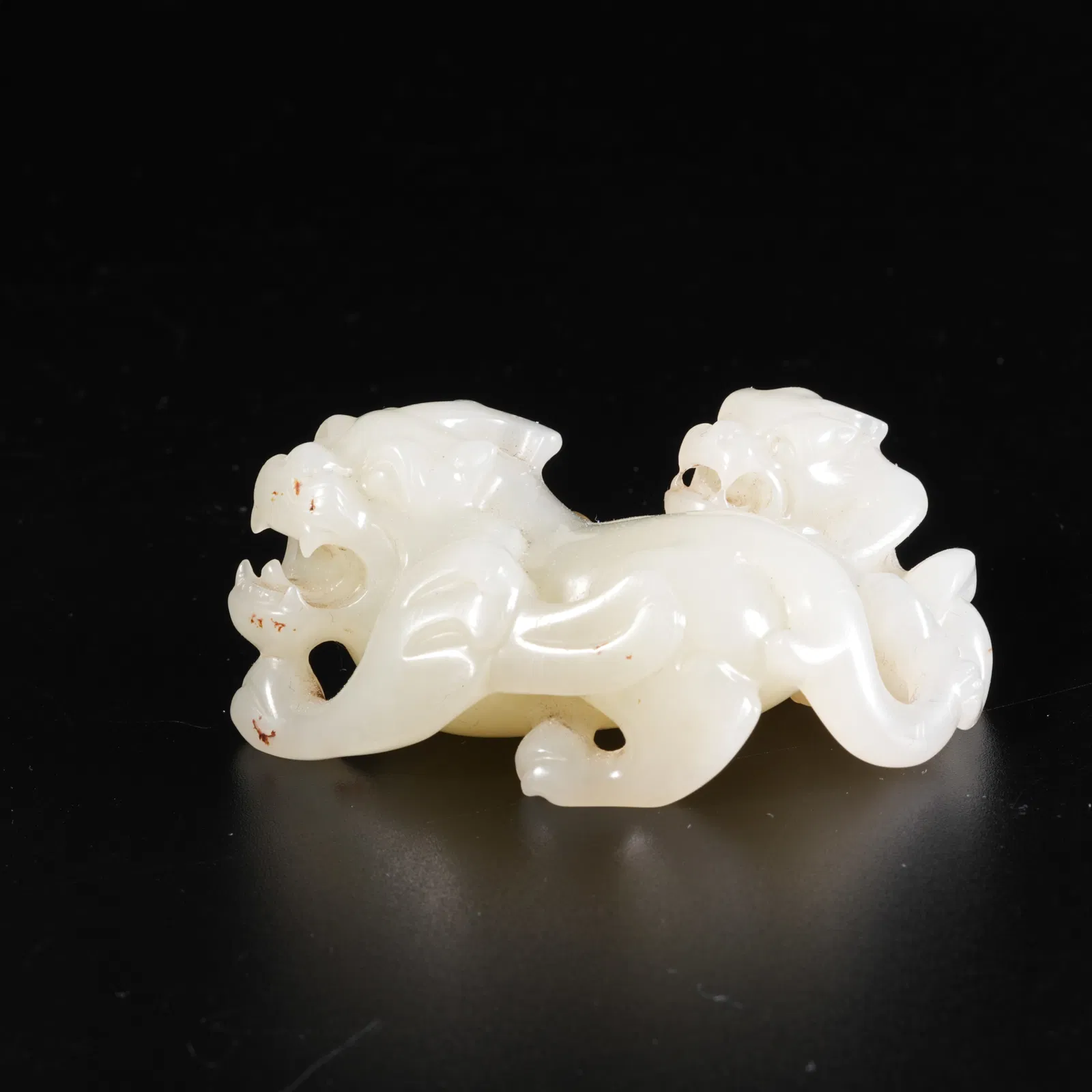 A HETIAN JADE BEAST-SHAPED ORNAMENT
