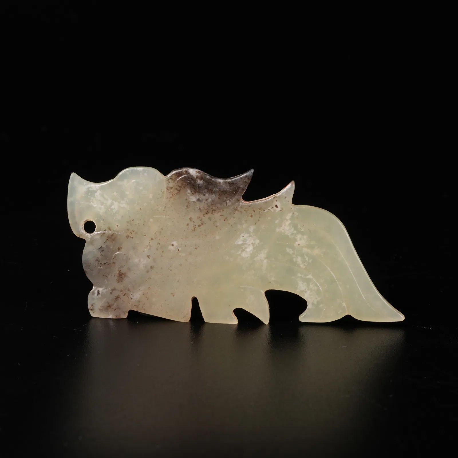 A HETIAN JADE BEAST-SHAPED PENDANT