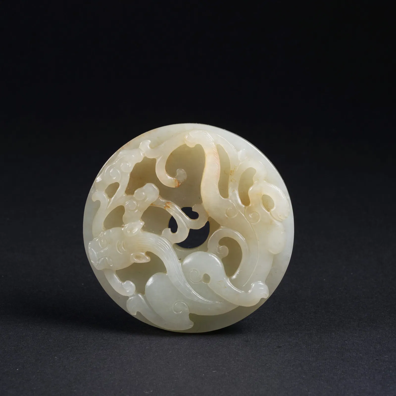 A HETIAN JADE BI DISC WITH CHI DRAGON MOTIF