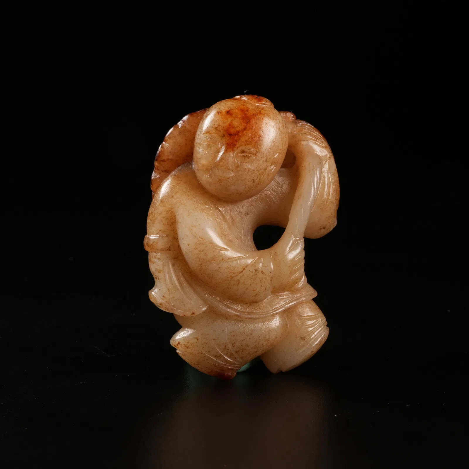 A HETIAN JADE BOY HOLDING LOTUS ORNAMENT