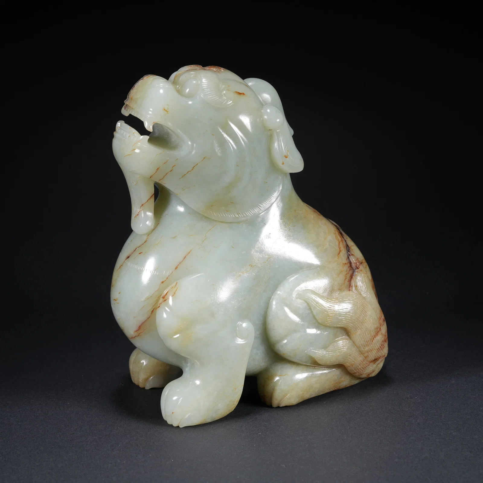 A HETIAN JADE CARVED ANIMAL-FORM FIGURE