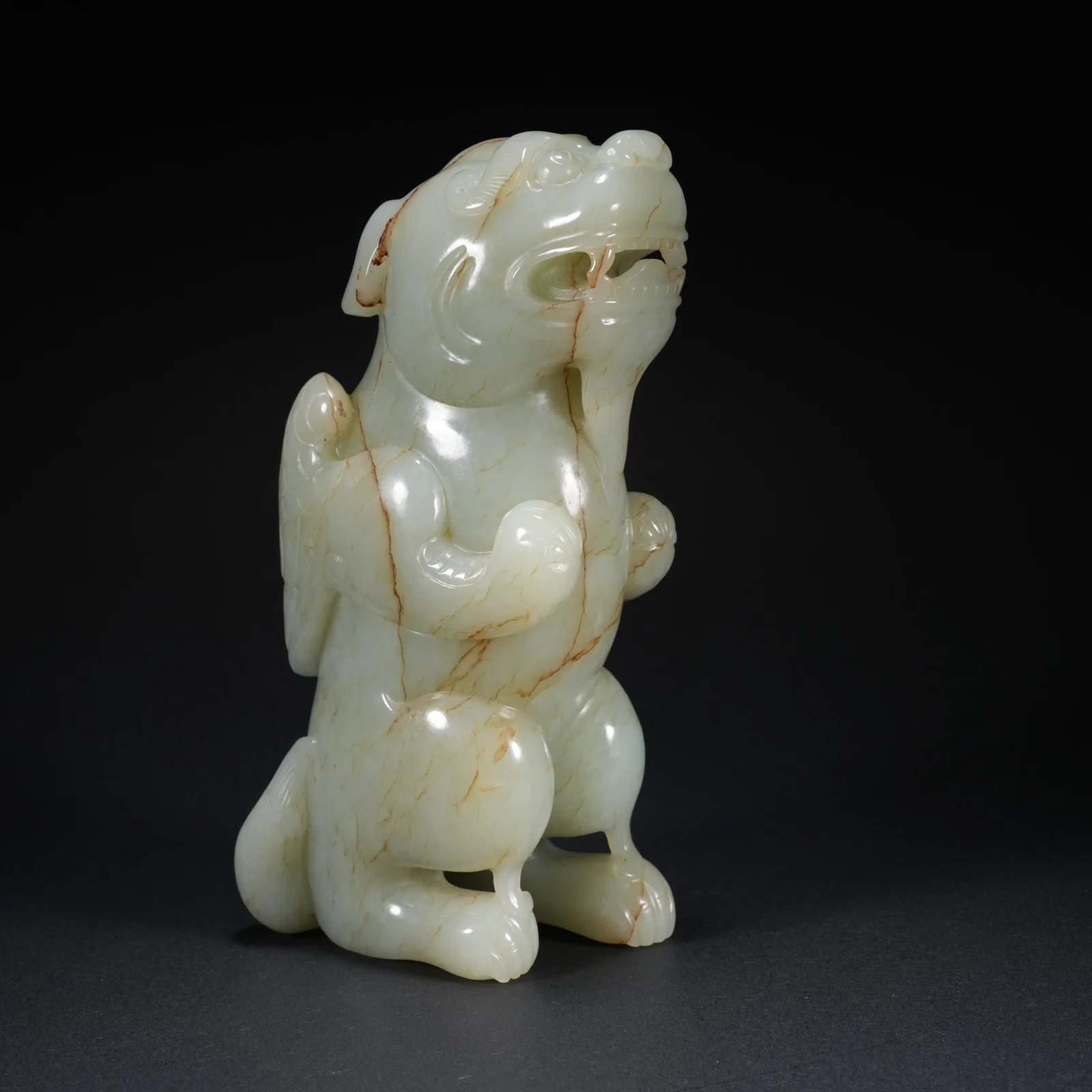 A HETIAN JADE CARVED AUSPICIOUS BEAST FIGURE