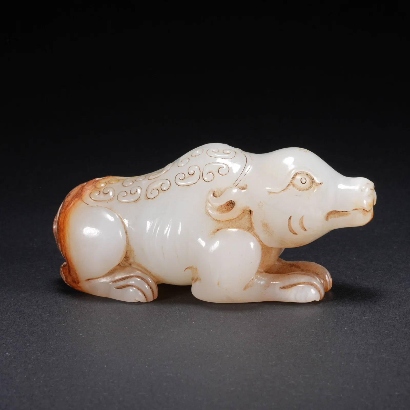 A HETIAN JADE CARVED BEAR FIGURE