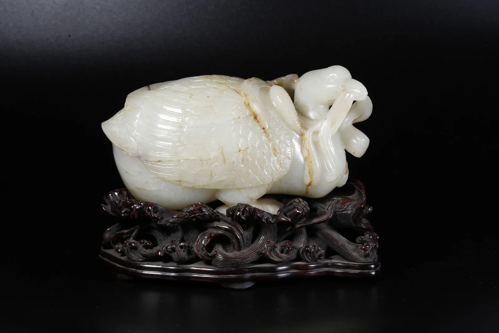 A HETIAN JADE CARVED DUCK-SHAPED ORNAMENT