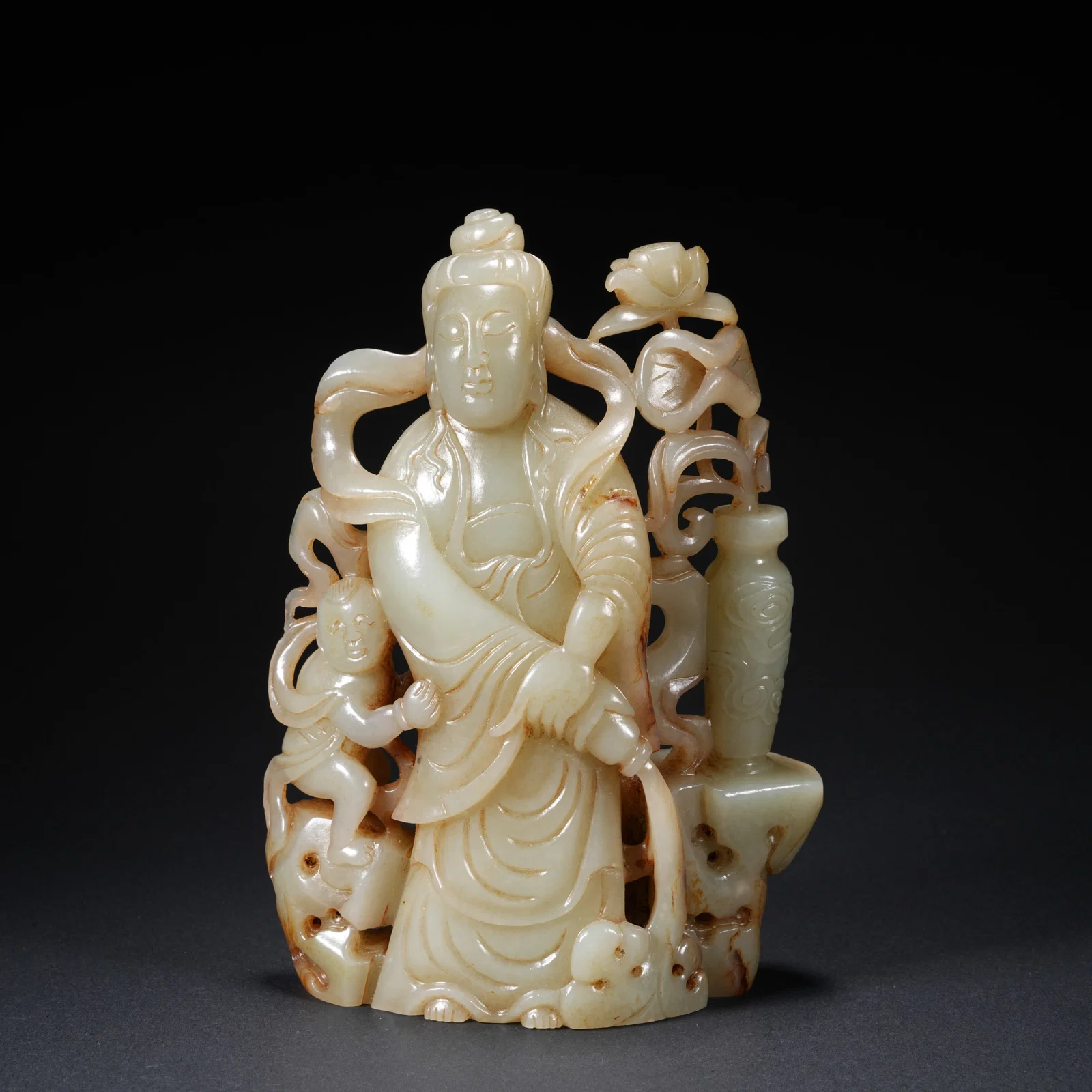 A HETIAN JADE CARVED GUANYIN FIGURE