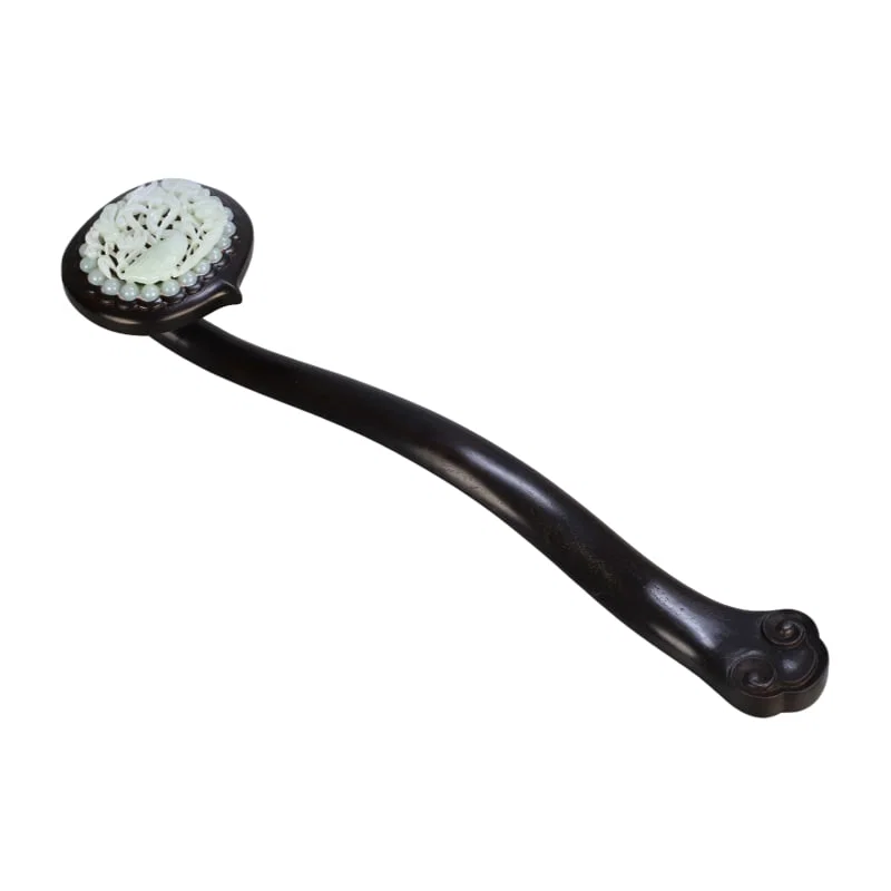 A Hetian jade carved hollow ruyi scepter.