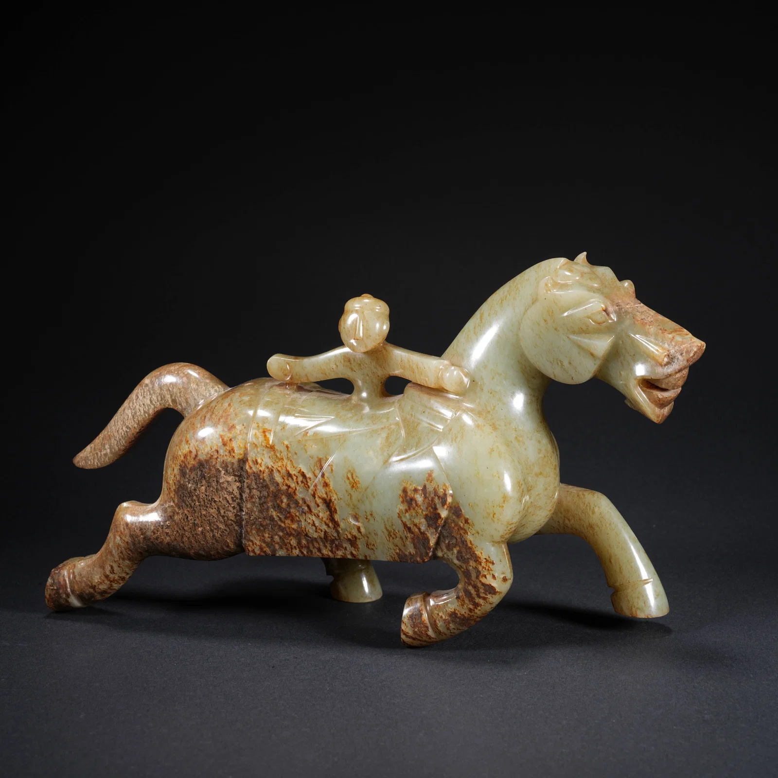 A HETIAN JADE CARVED HORSE-AND-FIGURE FIGURE