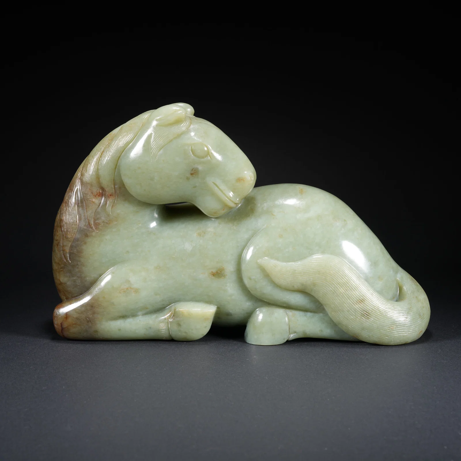 A HETIAN JADE CARVED HORSE-FORM FIGURE