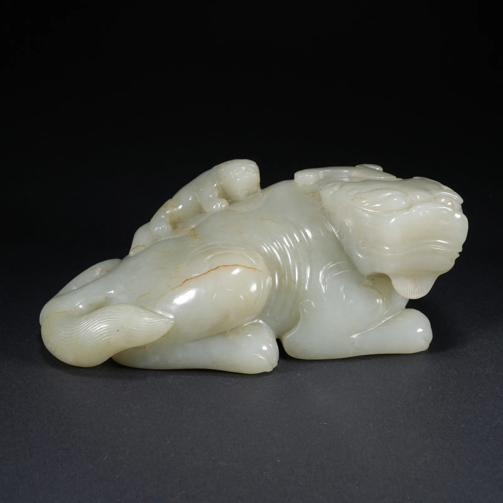 A HETIAN JADE CARVED LARGE AND SMALL LION FIGURES