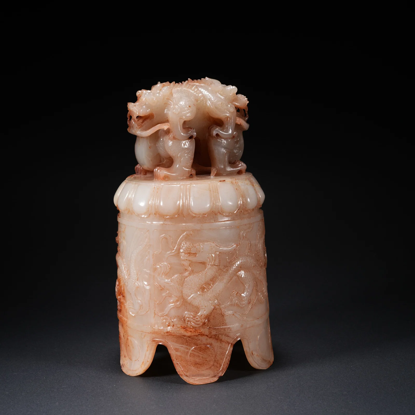 A HETIAN JADE CARVED ROUND BELL WITH DOUBLE-DRAGON FINIAL