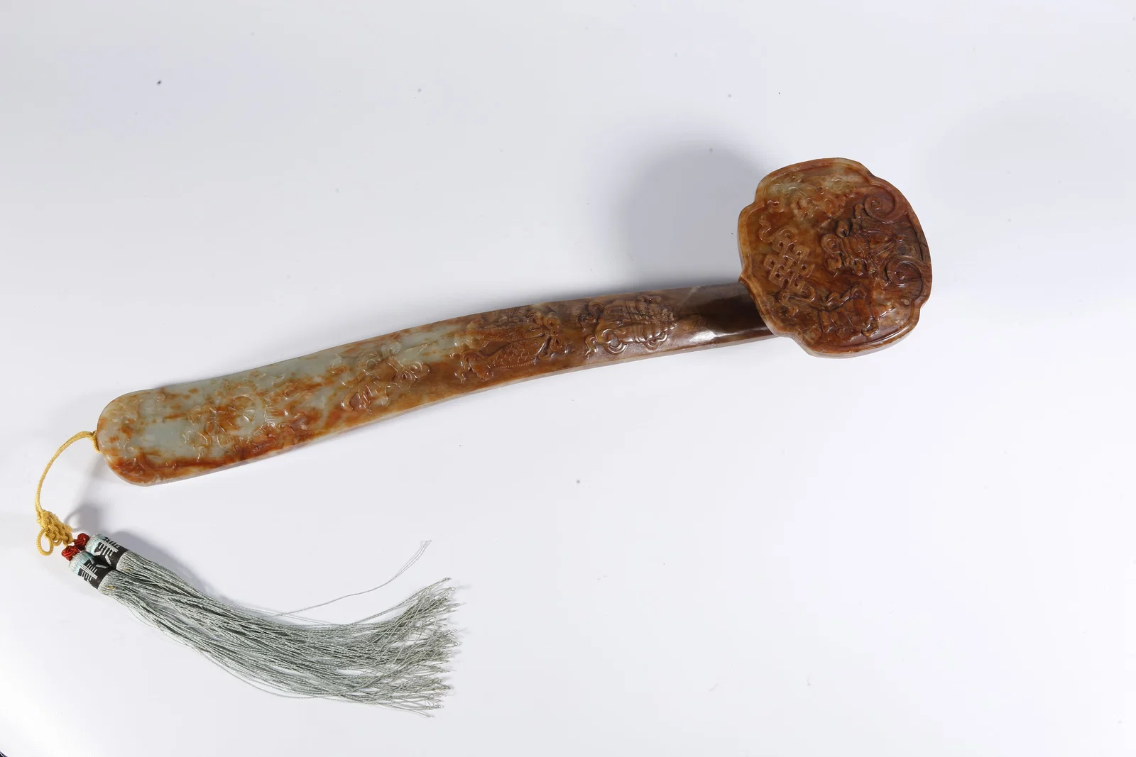A HETIAN JADE CARVED RUYI WITH EIGHT TREASURE DECORATION