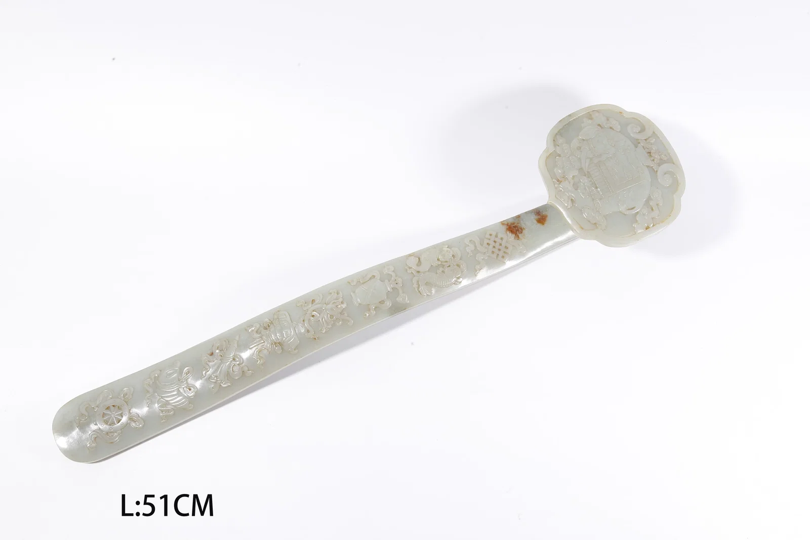 A HETIAN JADE CARVED RUYI WITH "EIGHT TREASURES" MOTIF