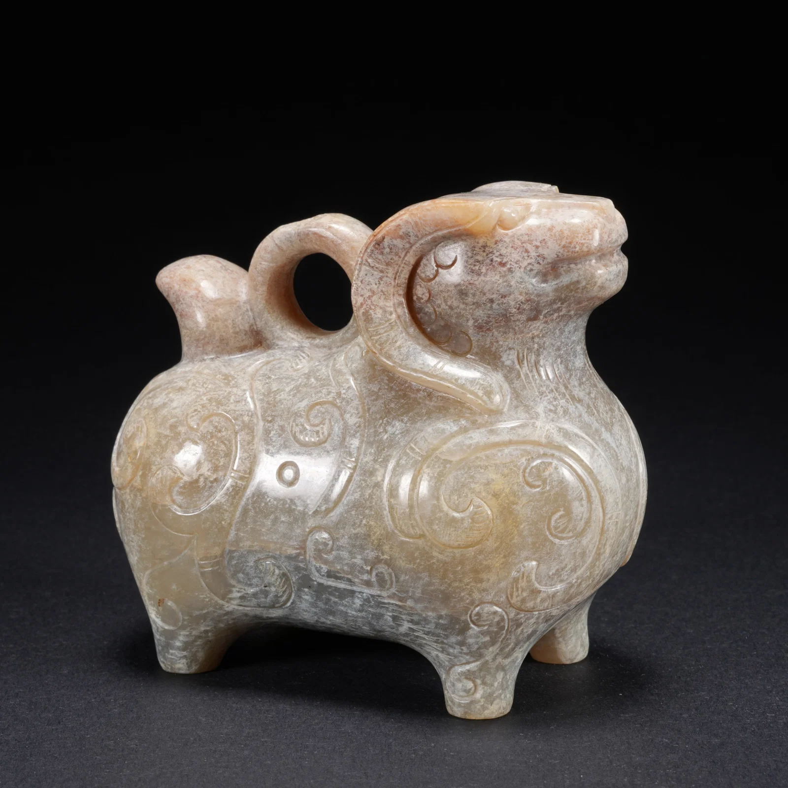 A HETIAN JADE CARVED SHEEP-FORM FIGURE