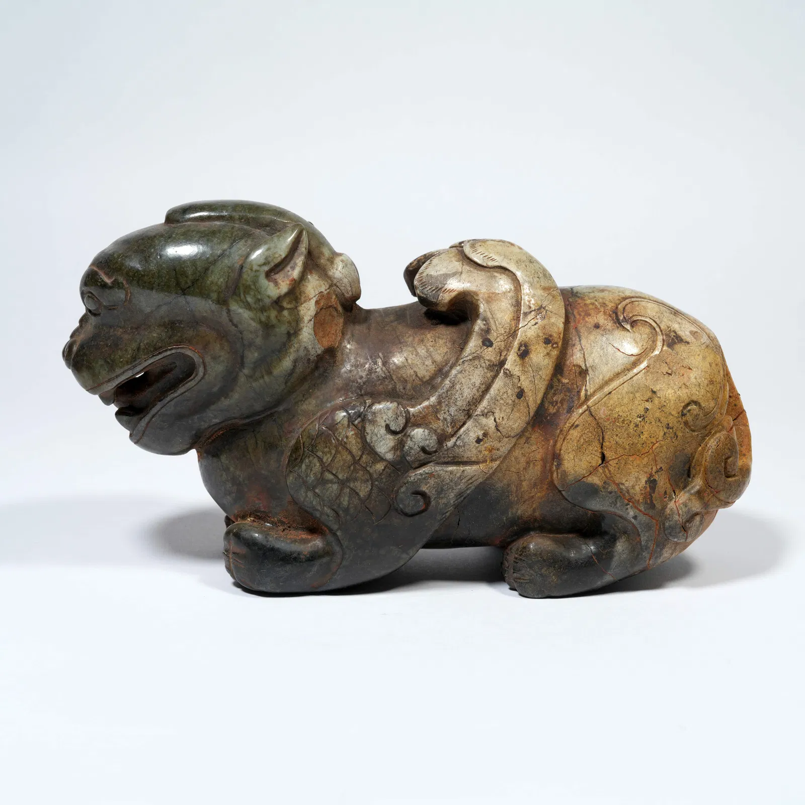 A HETIAN JADE CARVING OF A CHILONG AND TIGER-FORM ORNAMENT