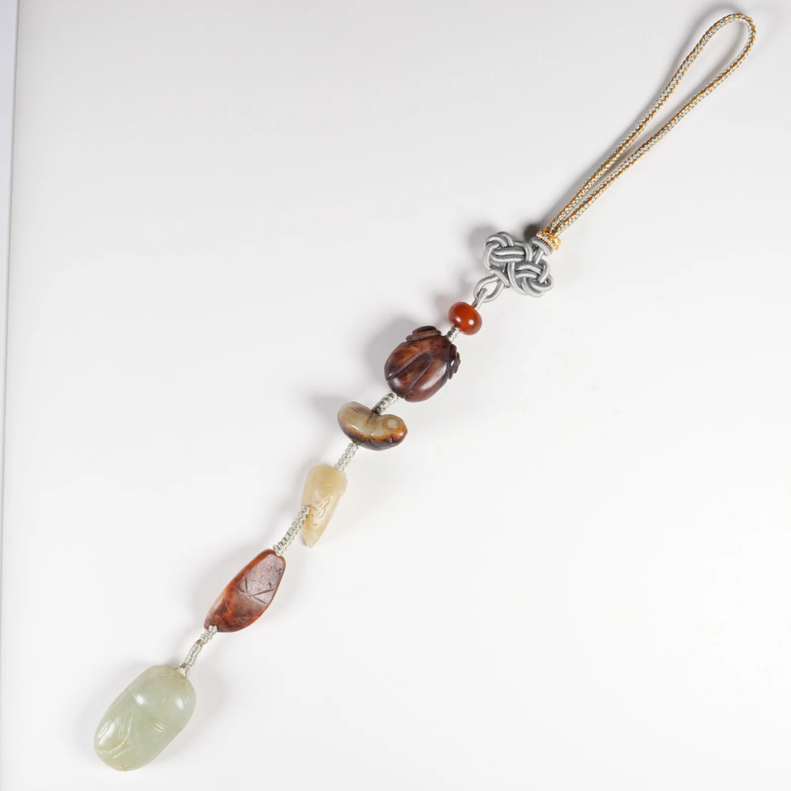 A HETIAN JADE CICADA MULTI-TREASURE BEAD STRAND