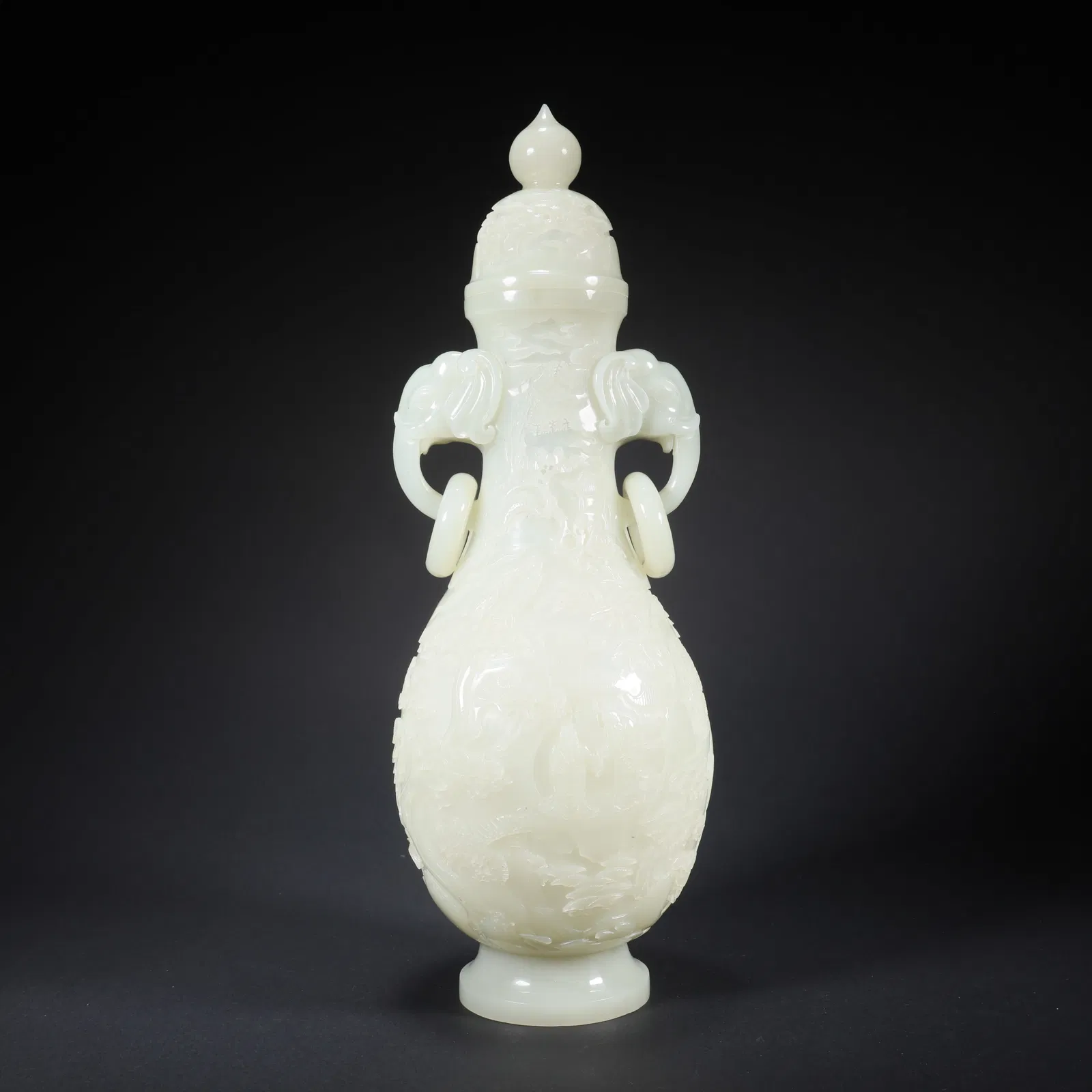 A HETIAN JADE COVERED VASE WITH DOUBLE ELEPHANT HANDLES, LANDSCAPE AND FIGURES