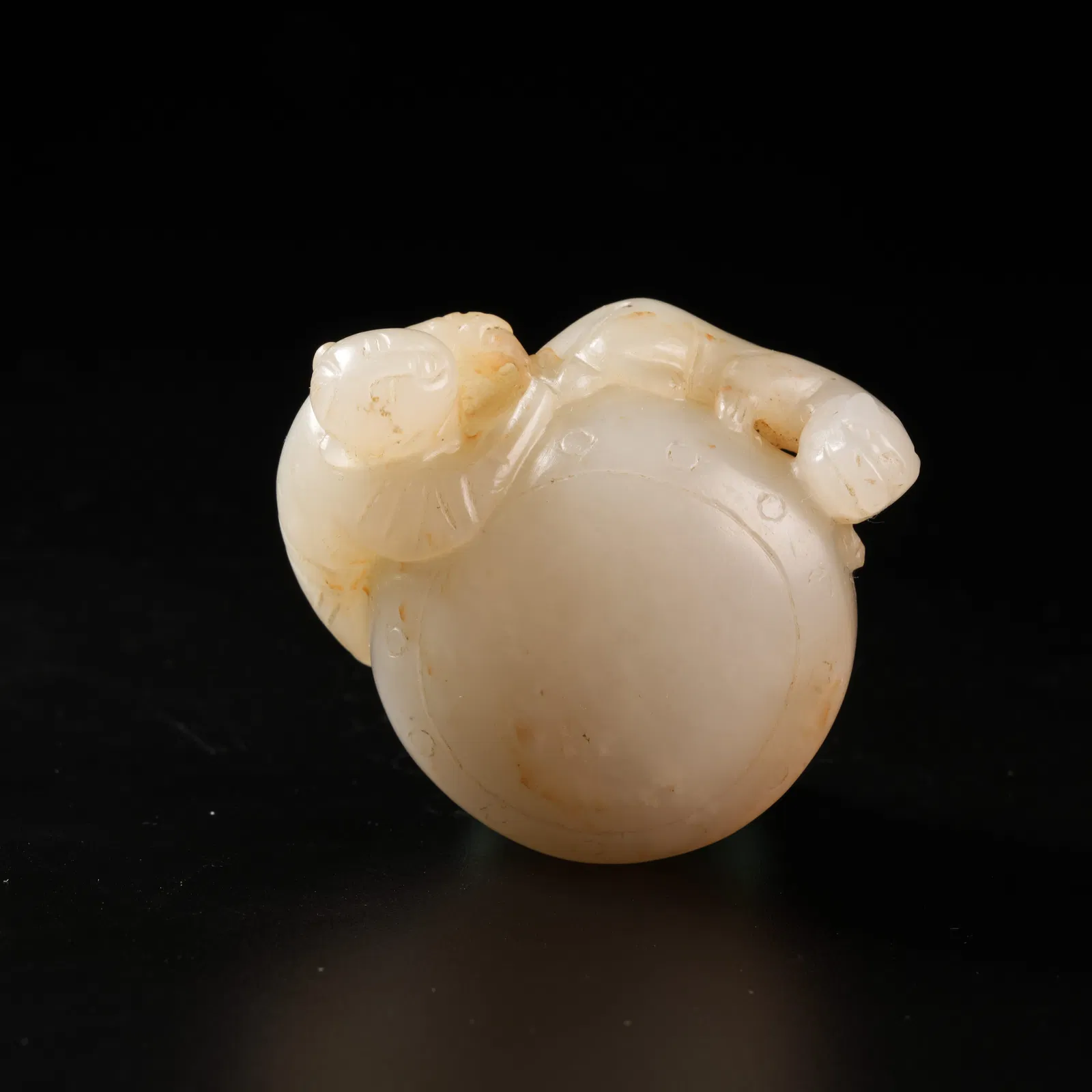 A HETIAN JADE DRUMMER BOY ORNAMENT