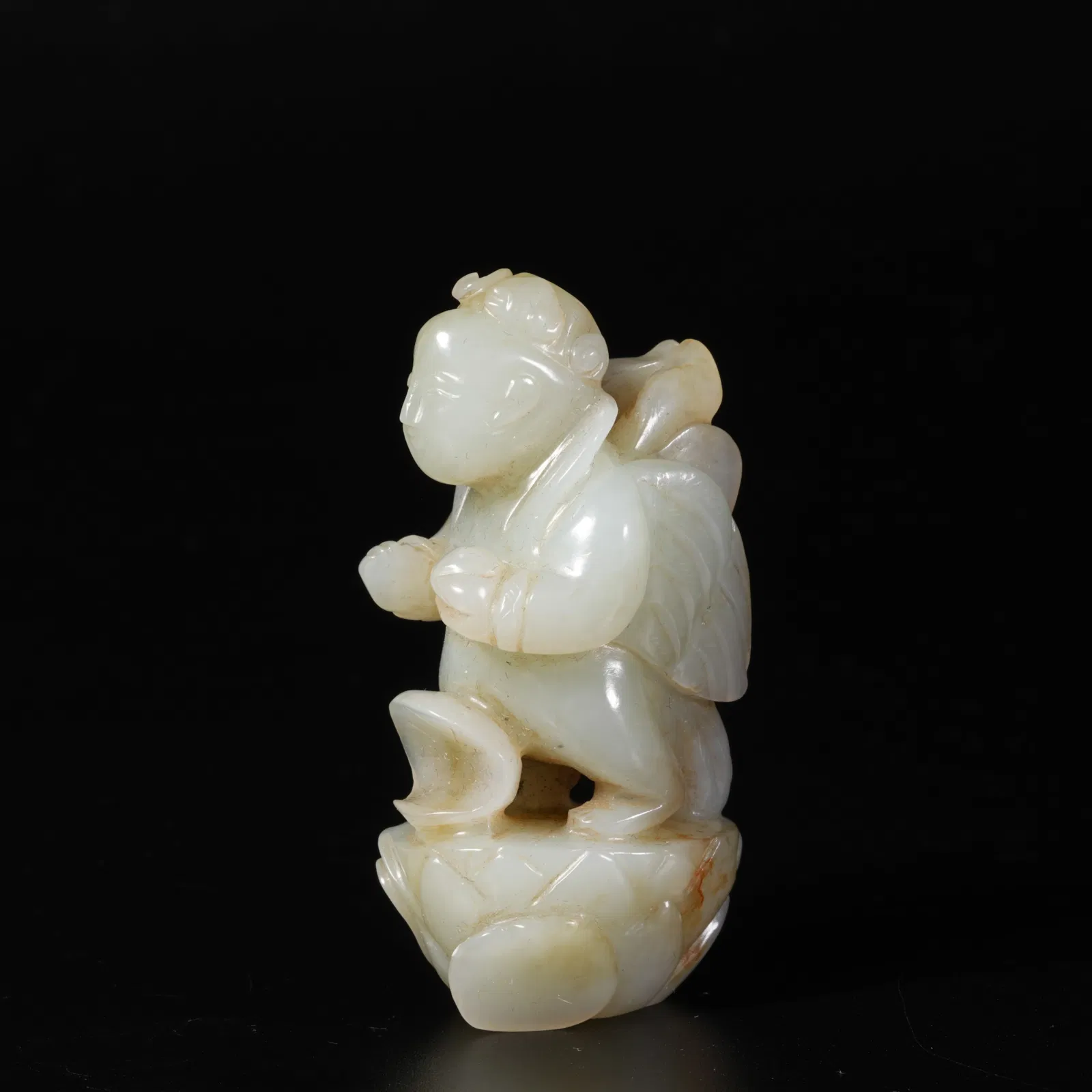 A HETIAN JADE FEATHERED IMMORTAL ORNAMENT