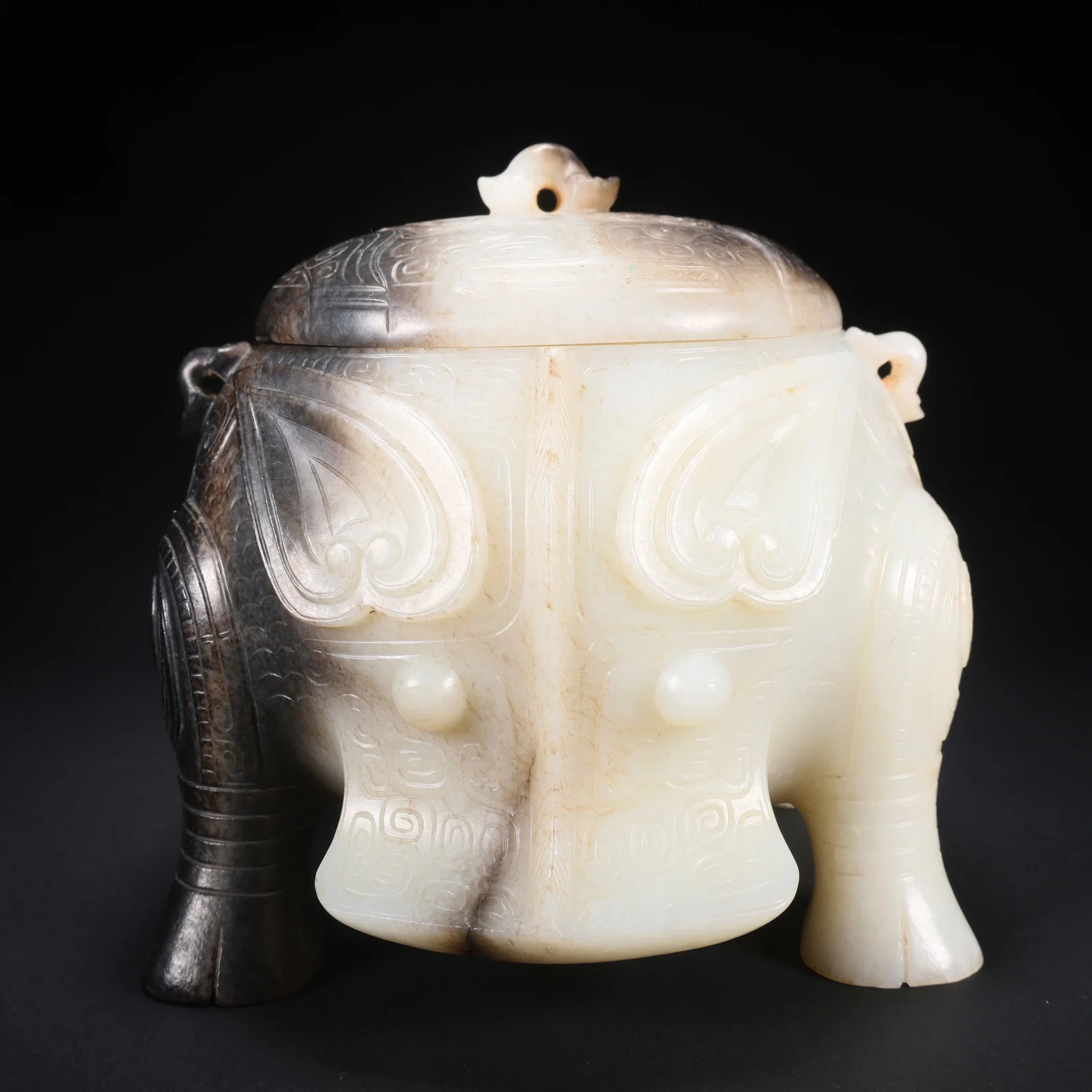 A HETIAN JADE FOUR-FOOT COVERED JAR WITH HUMAN FACE AND BEAST BODY