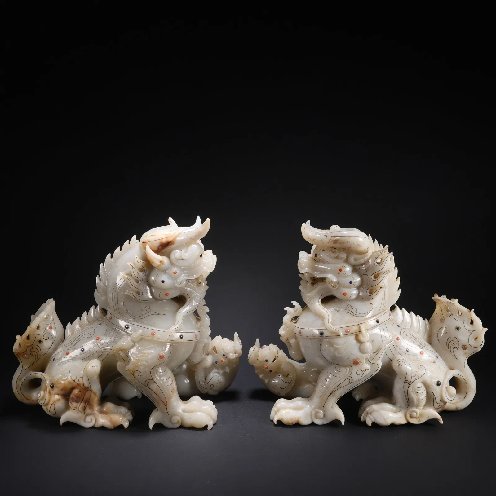 A HETIAN JADE GILT-AND-SILVER INLAID GEM QILIN, PAIR