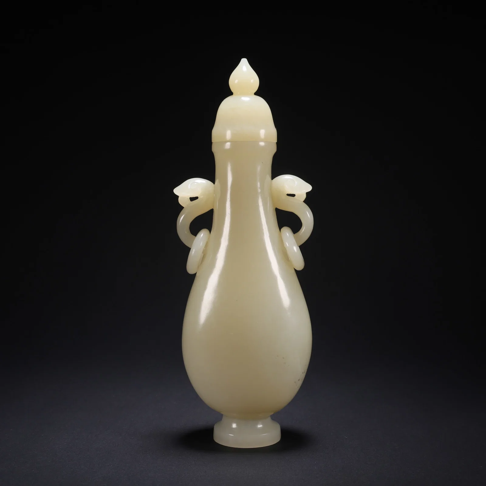 A HETIAN JADE HINGED RUYI-HANDLED COVERED VASE