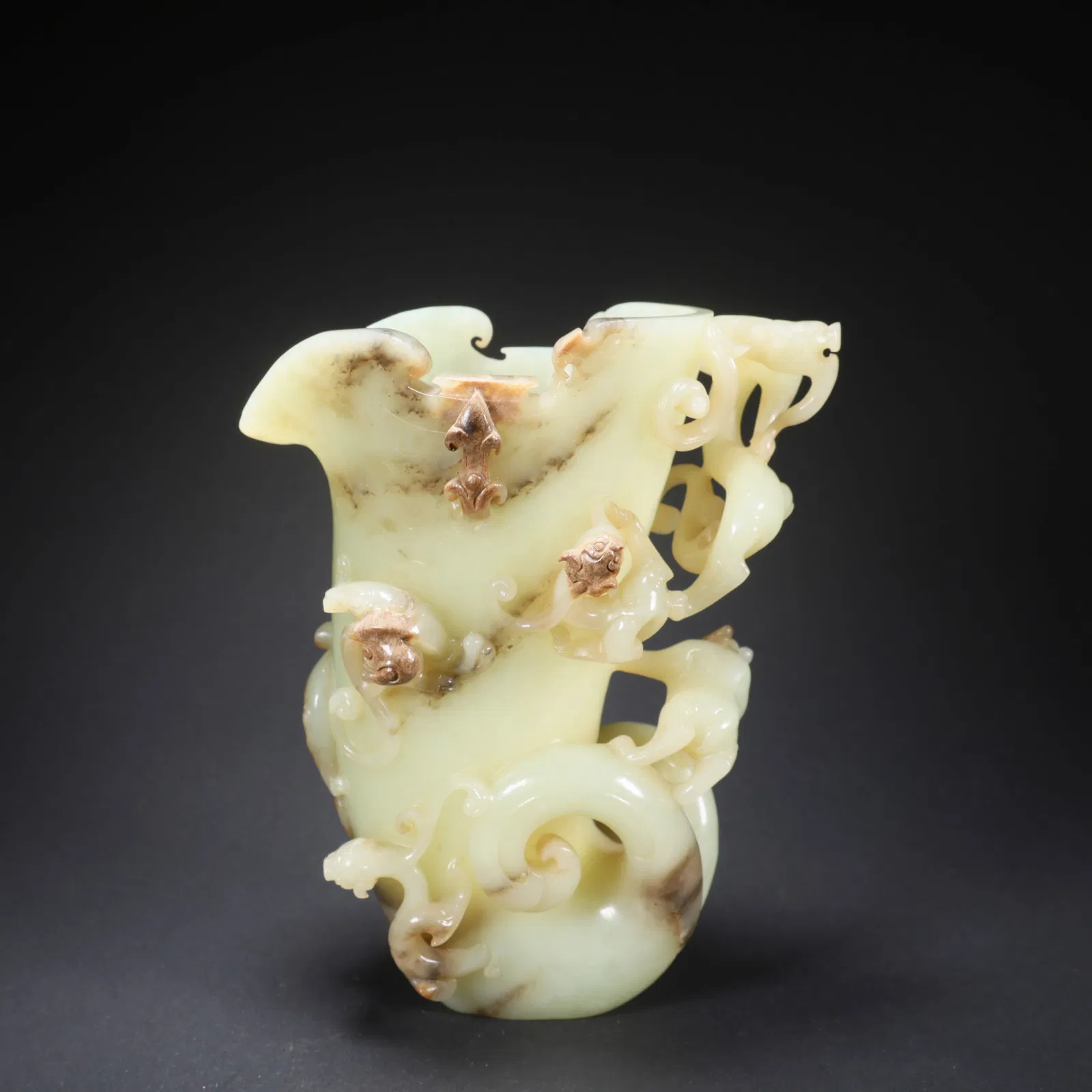 A HETIAN JADE HORN CUP WITH FIVE DRAGONS AND ONE BEAR