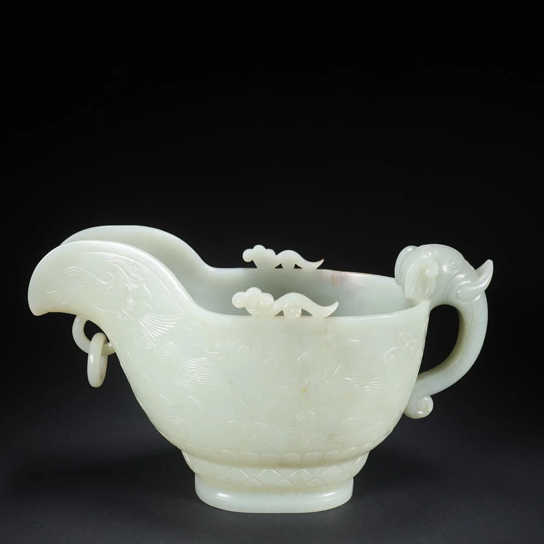 A HETIAN JADE HORN CUP WITH MOVABLE RING AND PHOENIX, BIRD, ELEPHANT-HEAD MOTIF