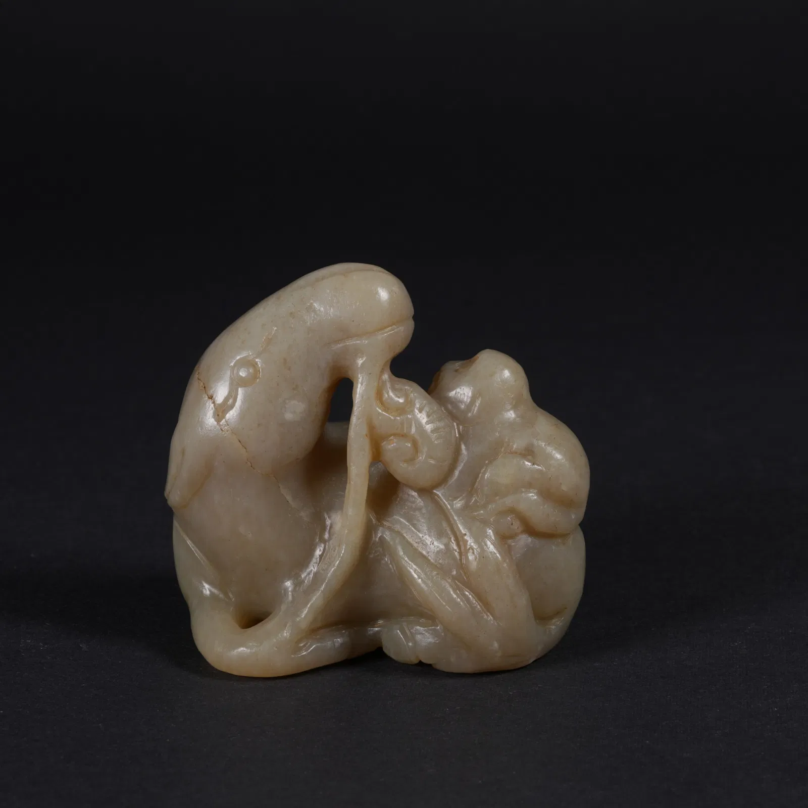 A HETIAN JADE "IMMEDIATE MARQUIS" (HORSE AND MONKEY) FIGURINE