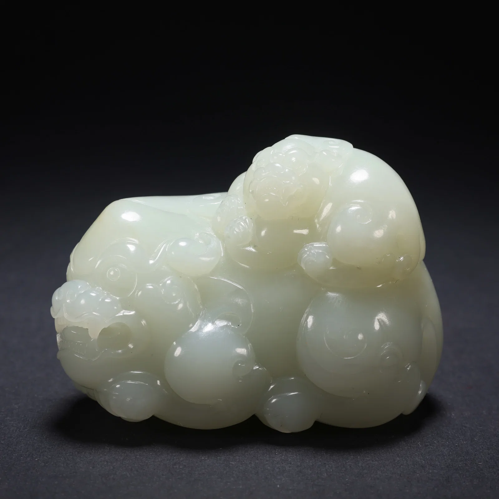 A HETIAN JADE MOTHER-AND-CHILD AUSPICIOUS BEAST