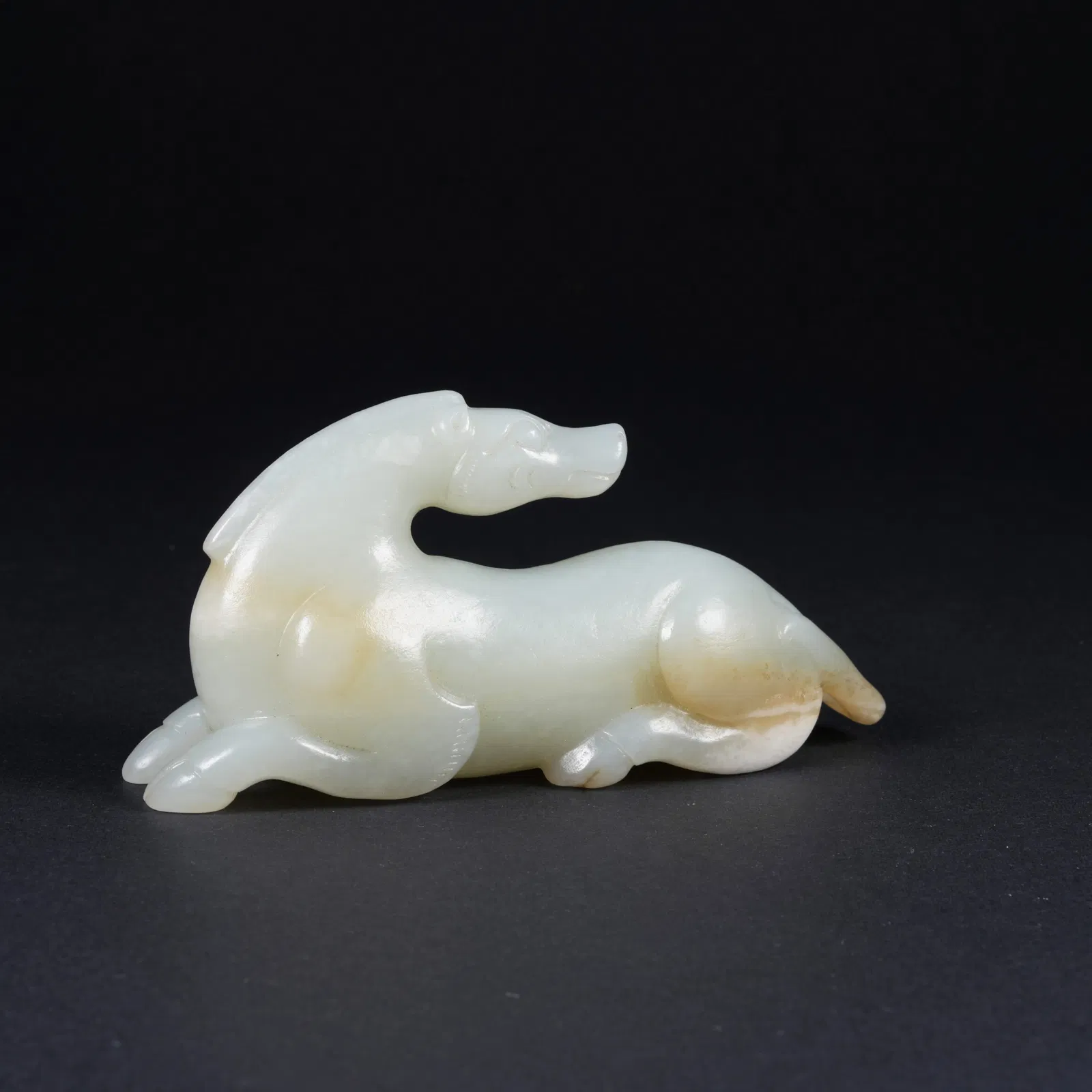 A HETIAN JADE MYTHICAL-BEAST PENDANT