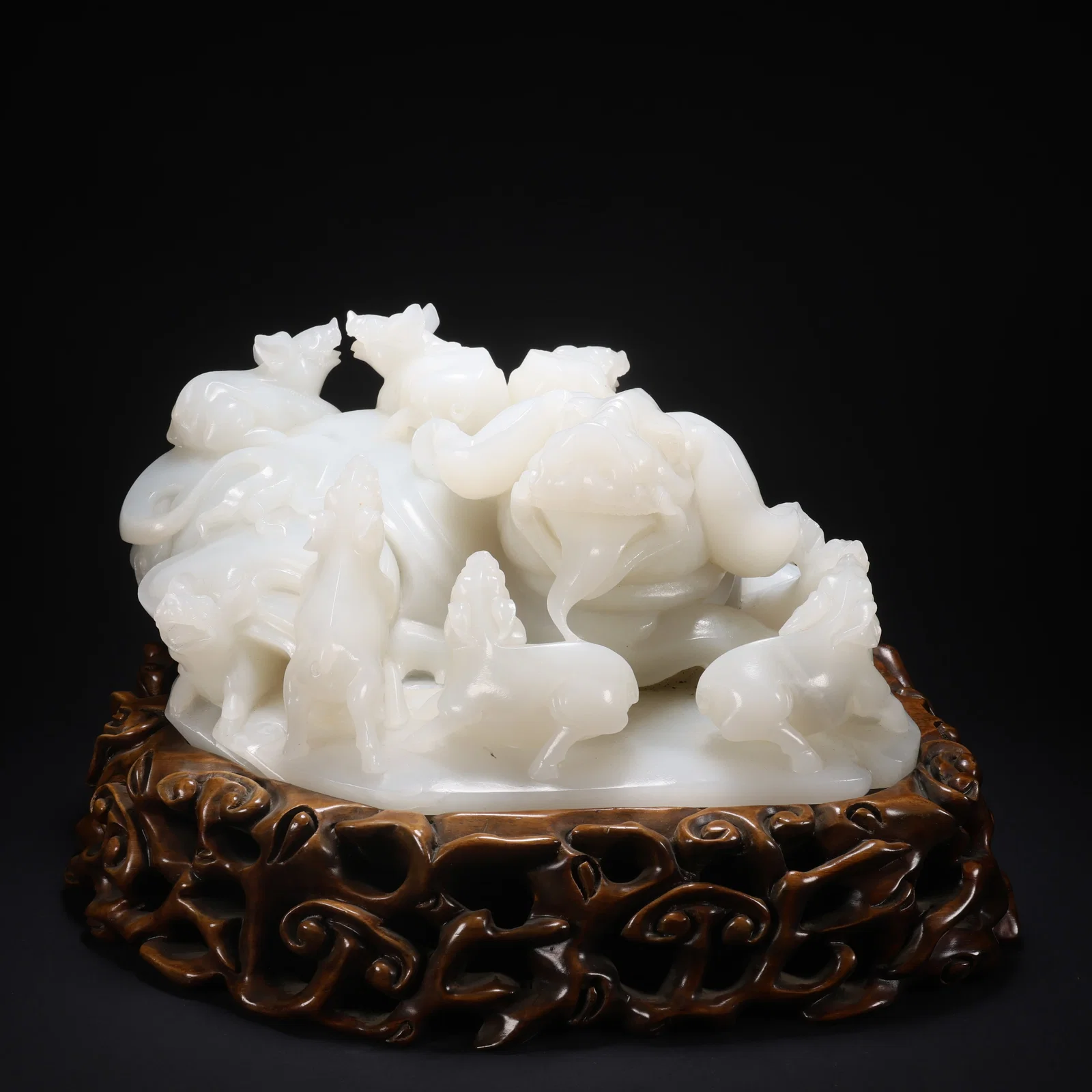 A HETIAN JADE ON WOODEN BASE FAMILY BLESSING SCENE