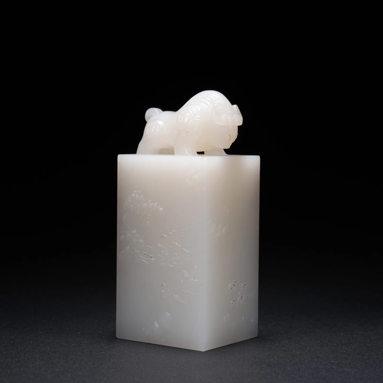 A HETIAN JADE PAPERWEIGHT WITH KUI-OX FINIAL