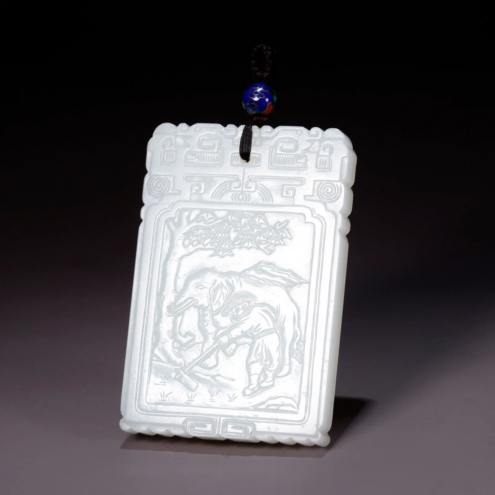 A HETIAN JADE "PEACE AND PROSPERITY" ELEPHANT PATTERN PLAQUE