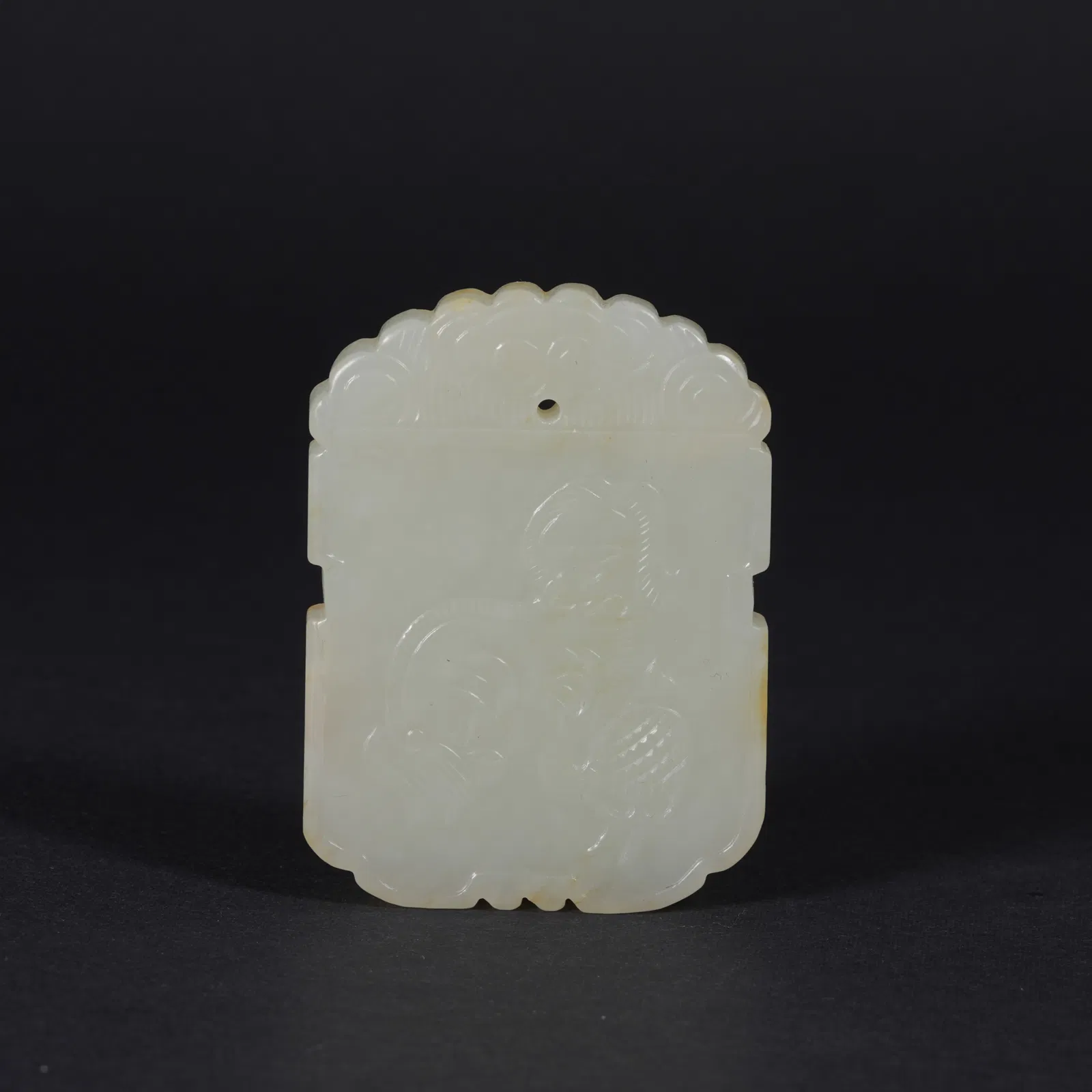 A HETIAN JADE PLAQUE WITH AUSPICIOUS BEAST MOTIF