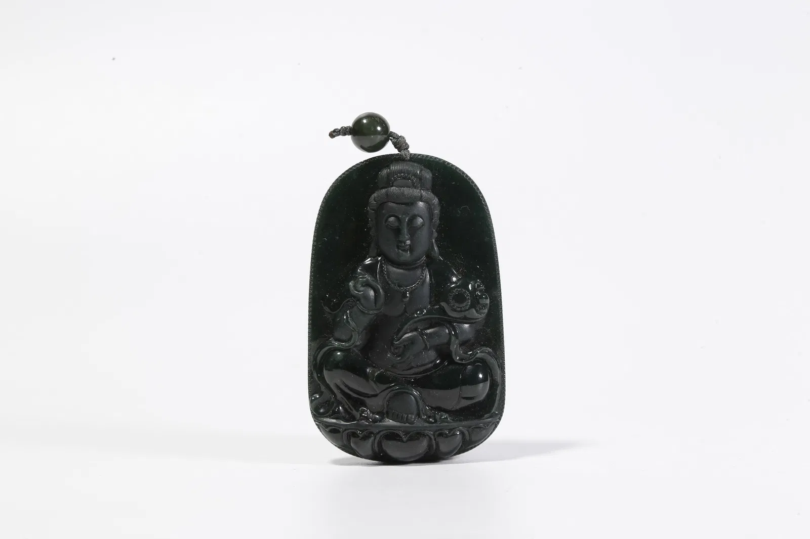 A HETIAN JADE PLAQUE WITH BUDDHA MOTIF