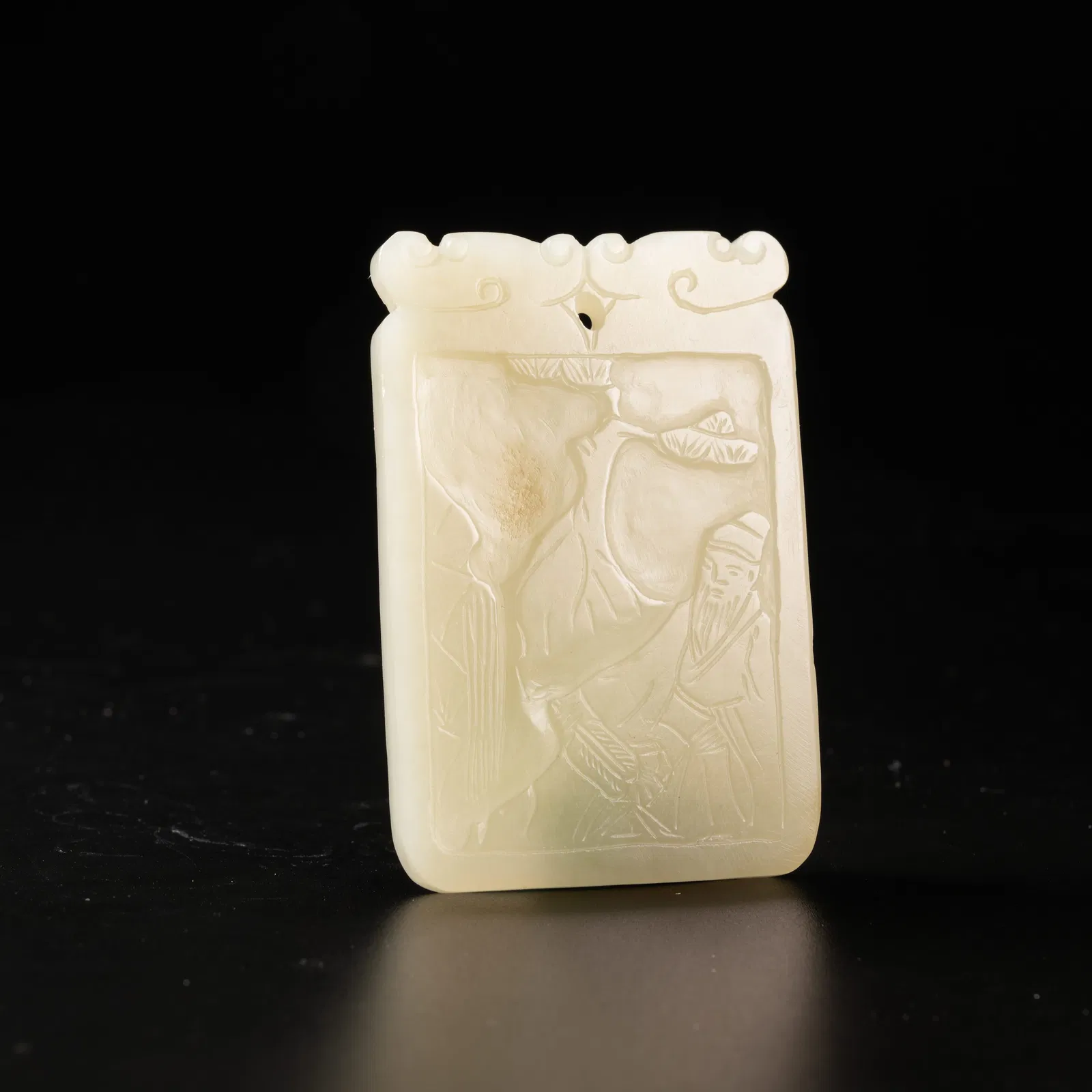 A HETIAN JADE PLAQUE WITH SCHOLAR UNDER PINE DESIGN