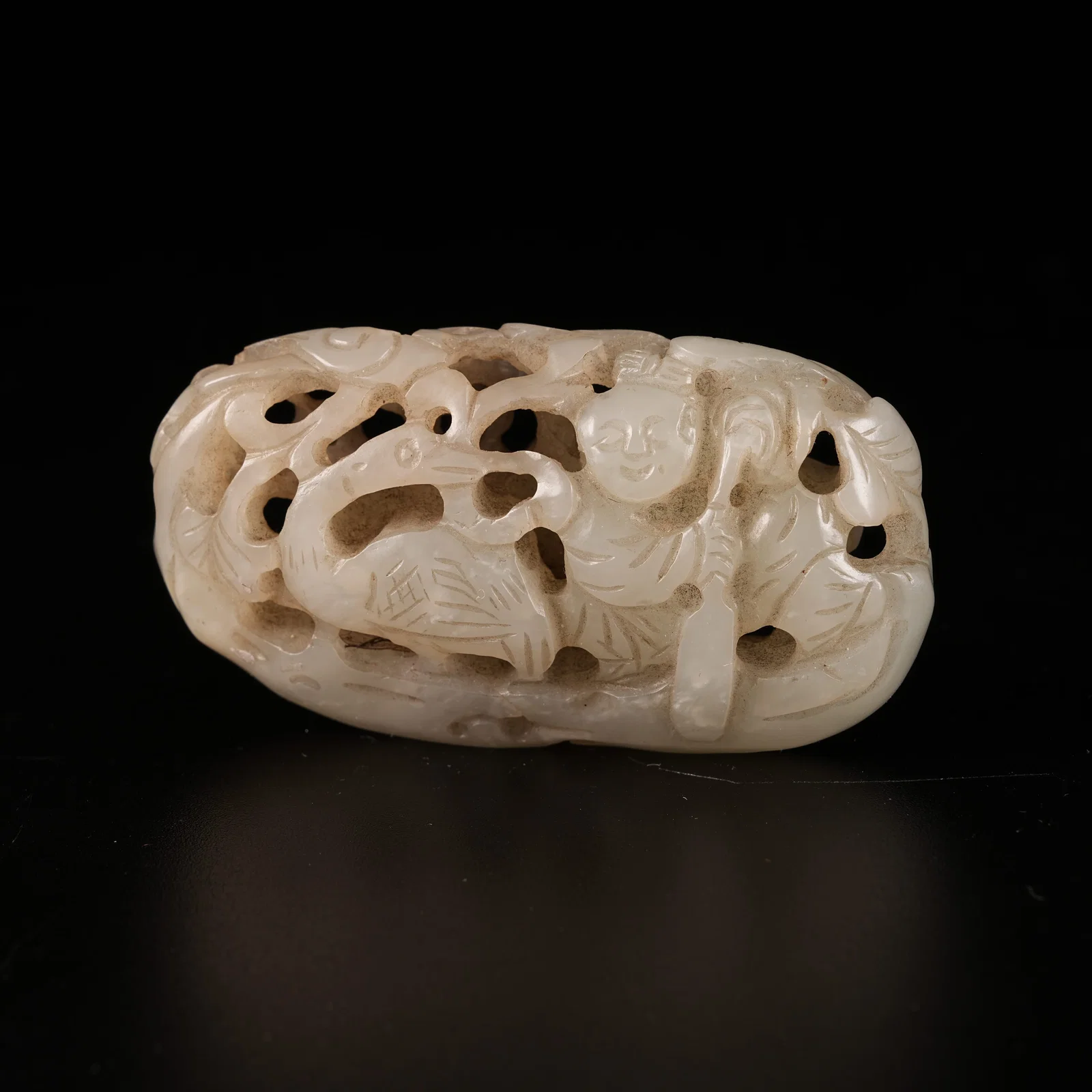 A HETIAN JADE PLAYING-CRANE BOY ORNAMENT