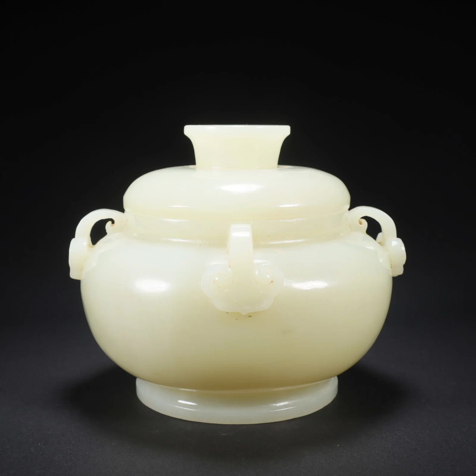 A HETIAN JADE QIANLONG-PERIOD COVERED JAR WITH FOUR RUYI HANDLES