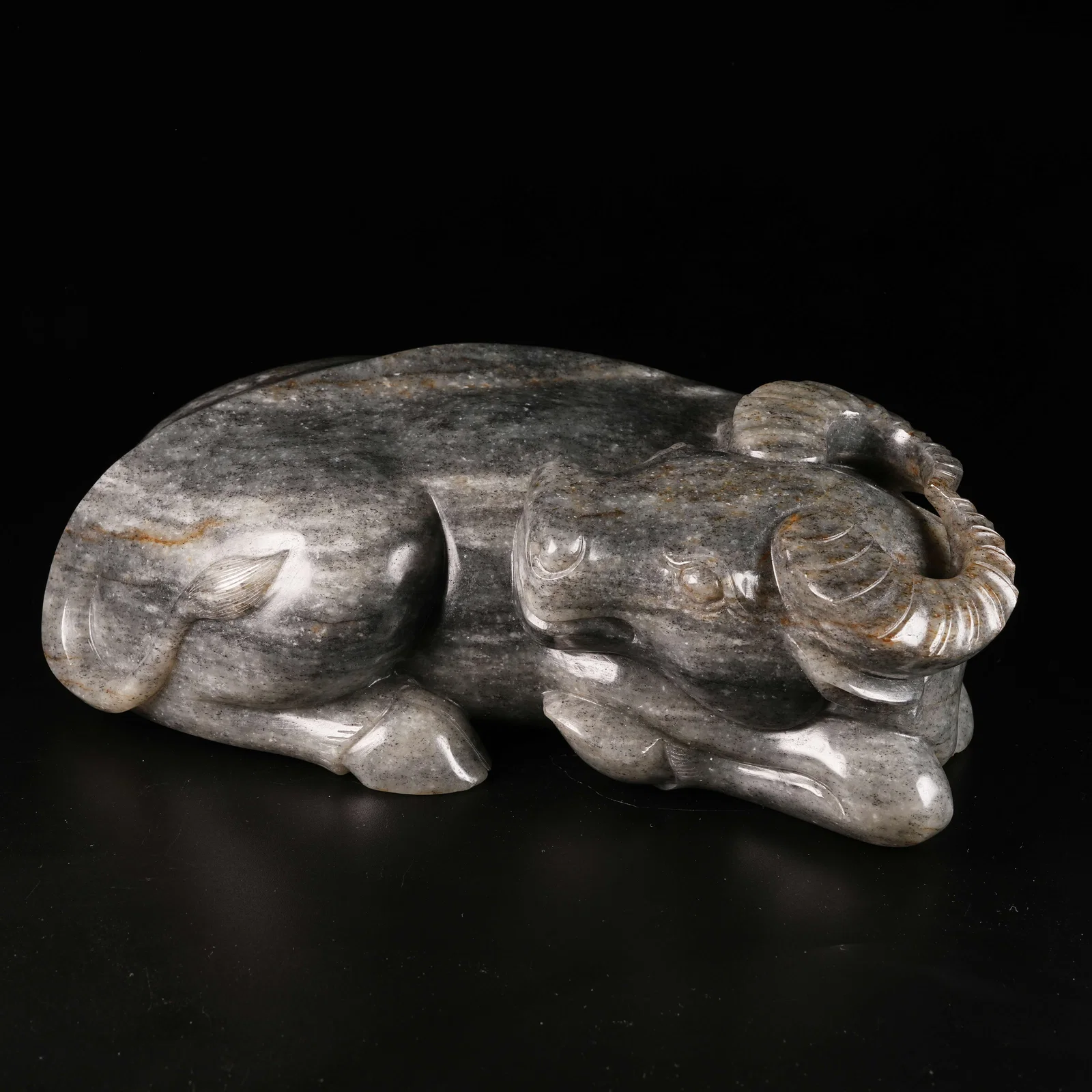A HETIAN JADE RECUMBENT OX ORNAMENT