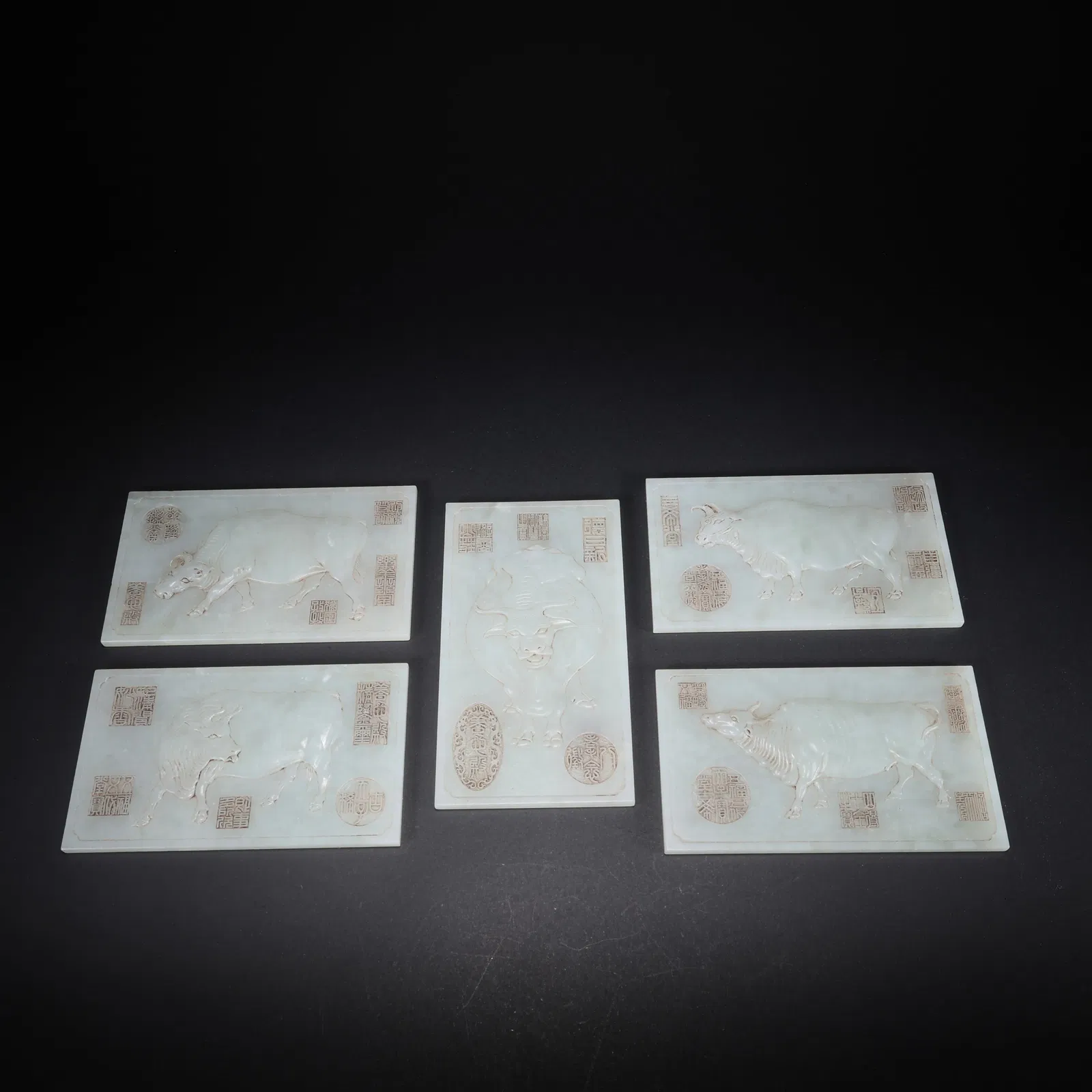 A HETIAN JADE SET OF FIVE CATTLE JADE TABLETS CARVED WITH POETRY