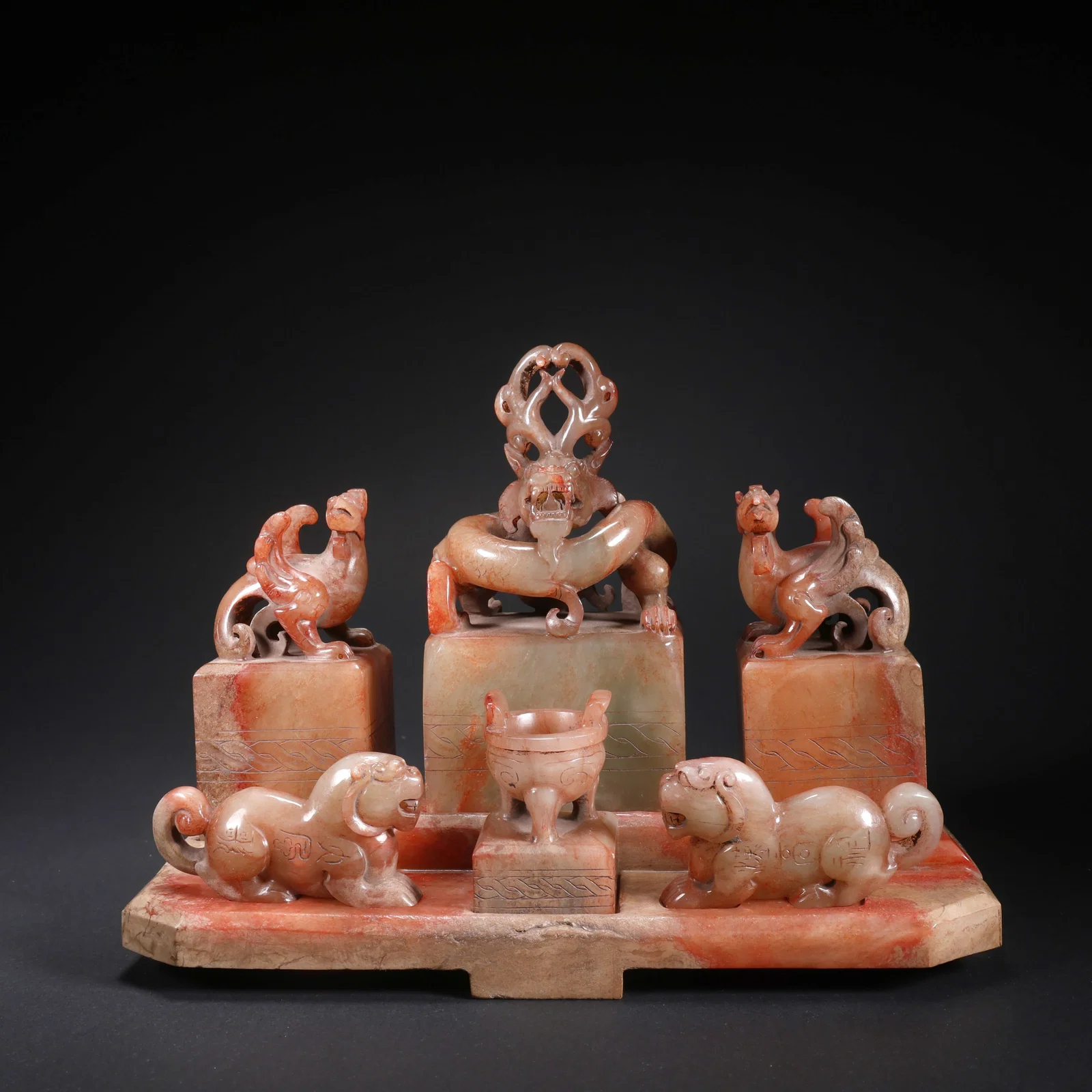 A HETIAN JADE SET OF SEVEN COMBINED SEALS
