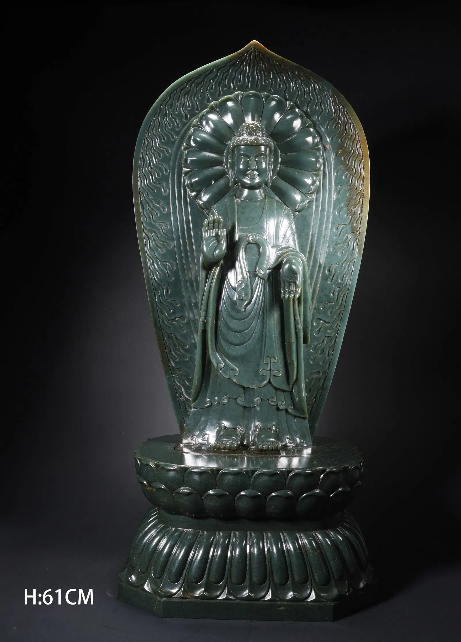 A HETIAN JADE STANDING GUANYIN WITH HALO ON LOTUS BASE