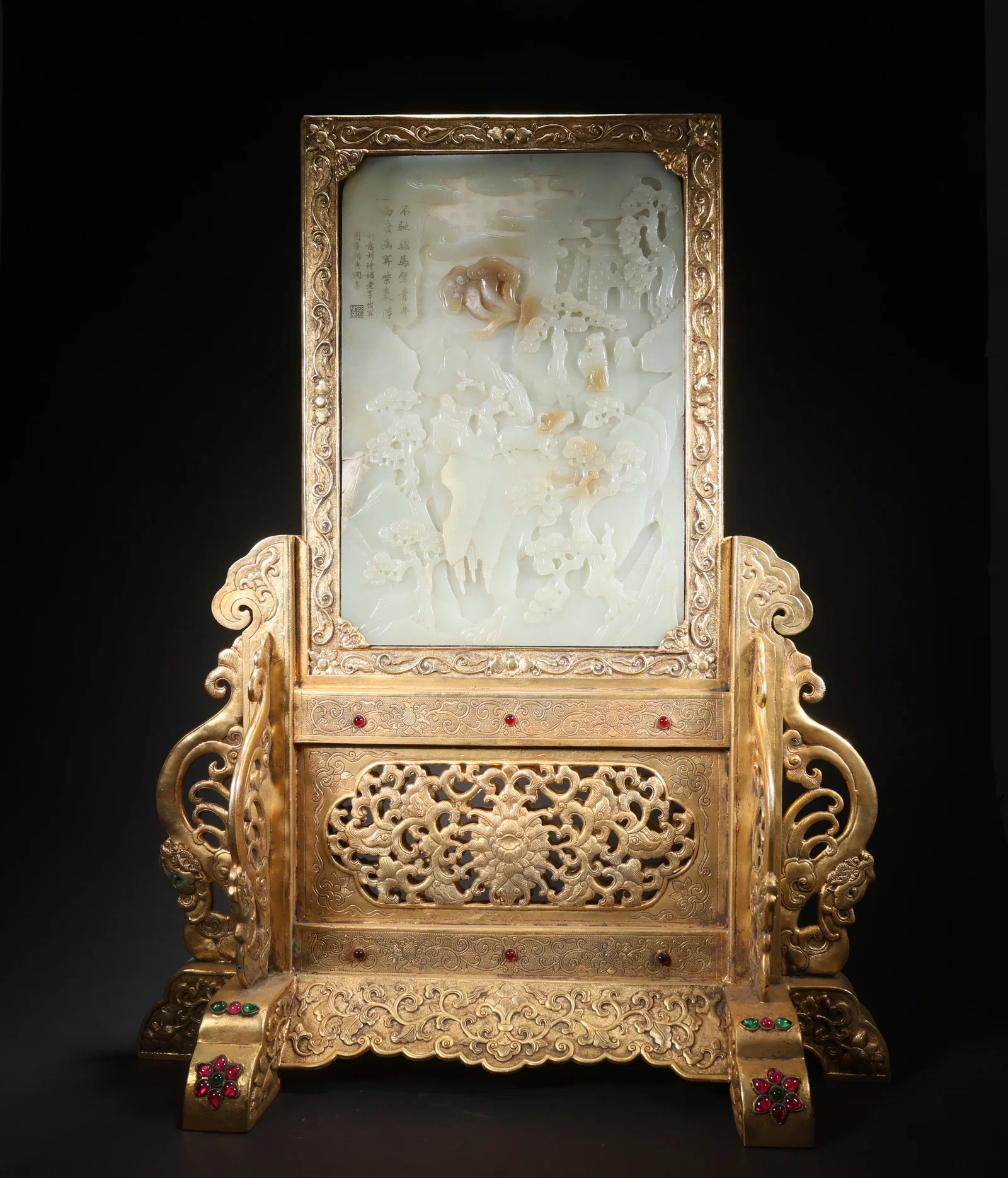 A HETIAN JADE TABLE SCREEN WITH LAOZI LEAVING THE PASS, ON BRONZE, GILT, AND GEMSTONE BASE