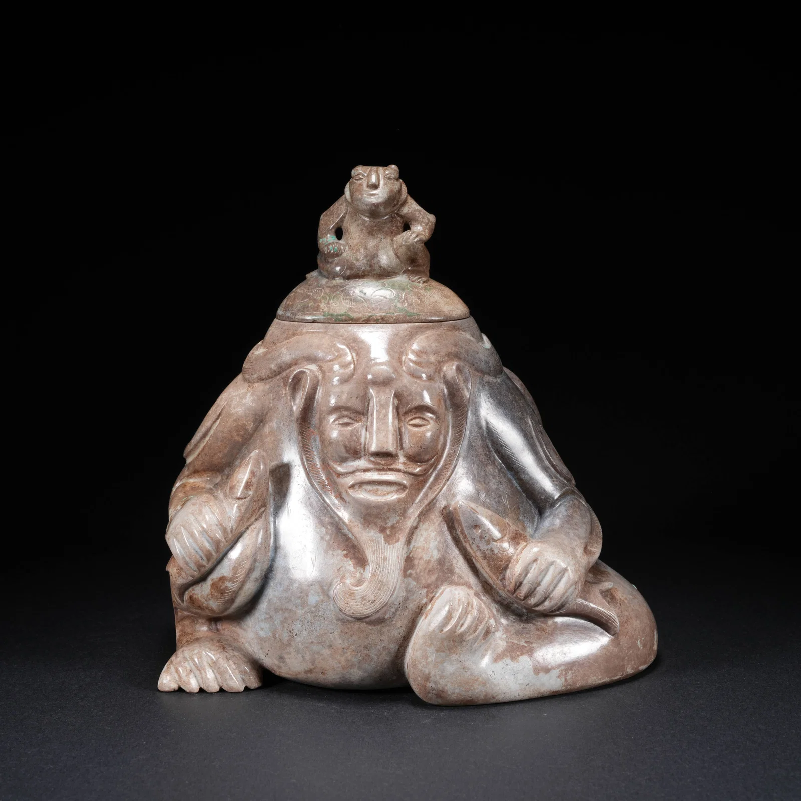 A HETIAN JADE ZUN WITH HUMAN FACE DESIGN