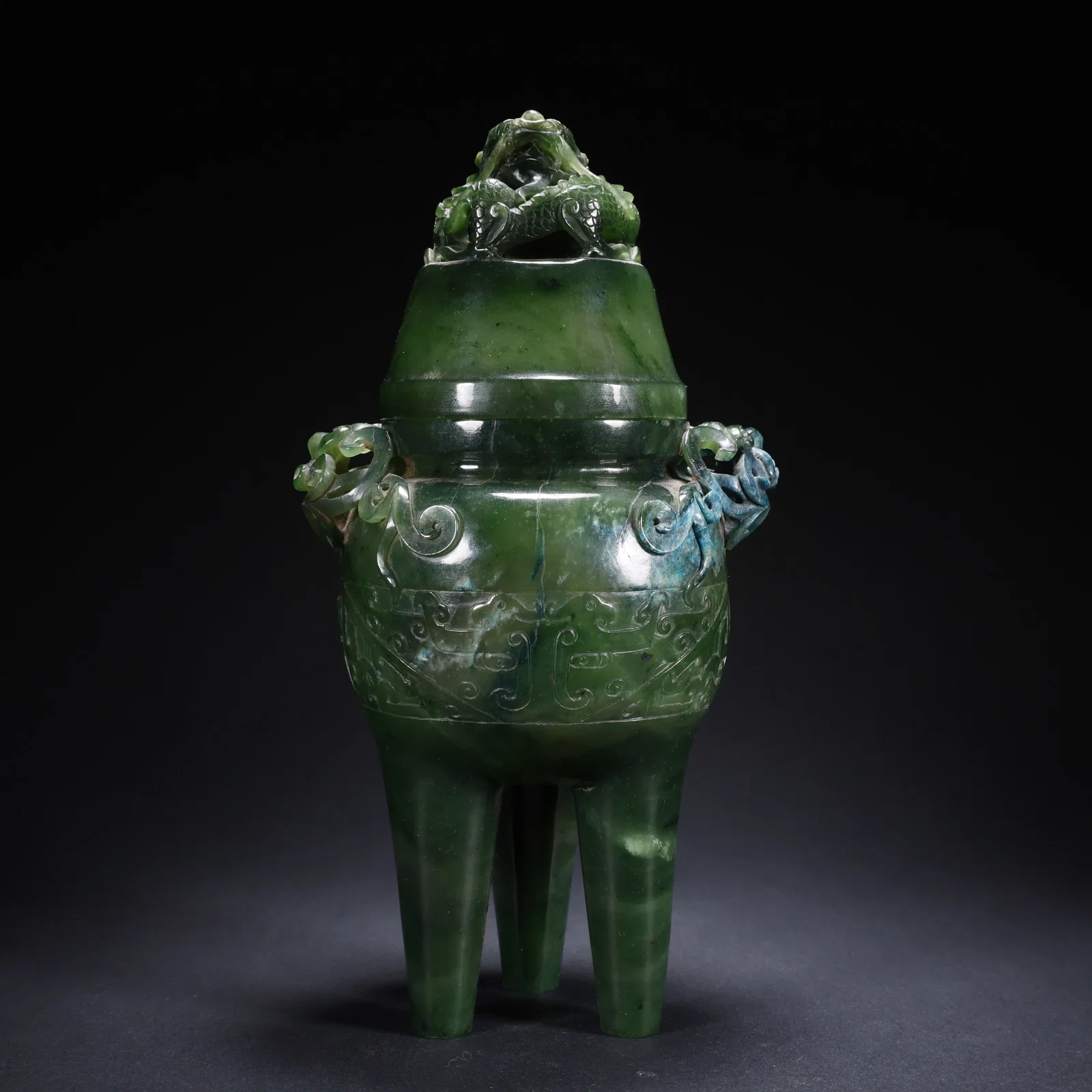 A HETIAN JASPER COVERED DRAGON CENSER WITH FLORAL HANDLES AND TALL FOOT ON WOODEN BASE