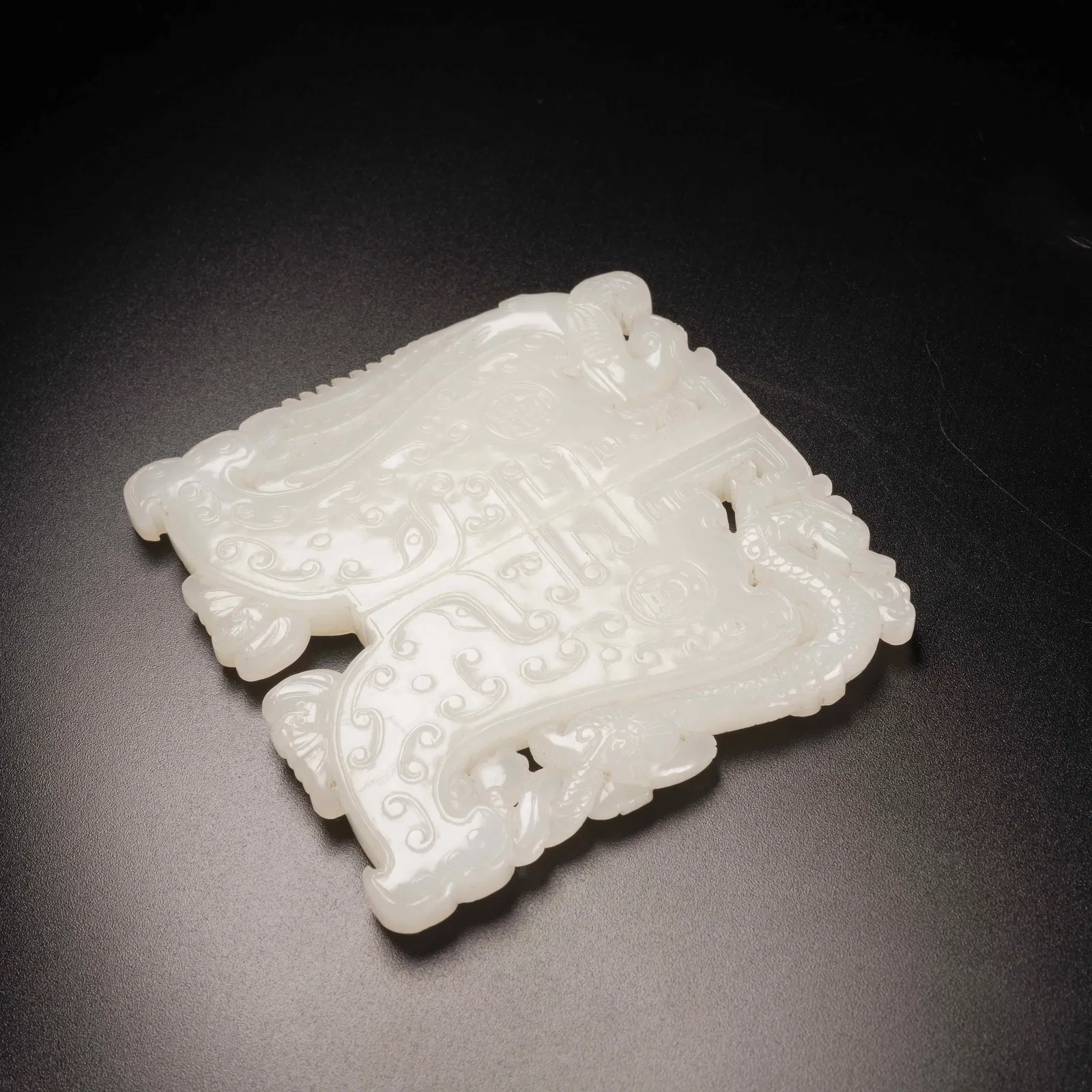 A HETIAN WHITE JADE DRAGON-AND-PHOENIX PENDANT SET