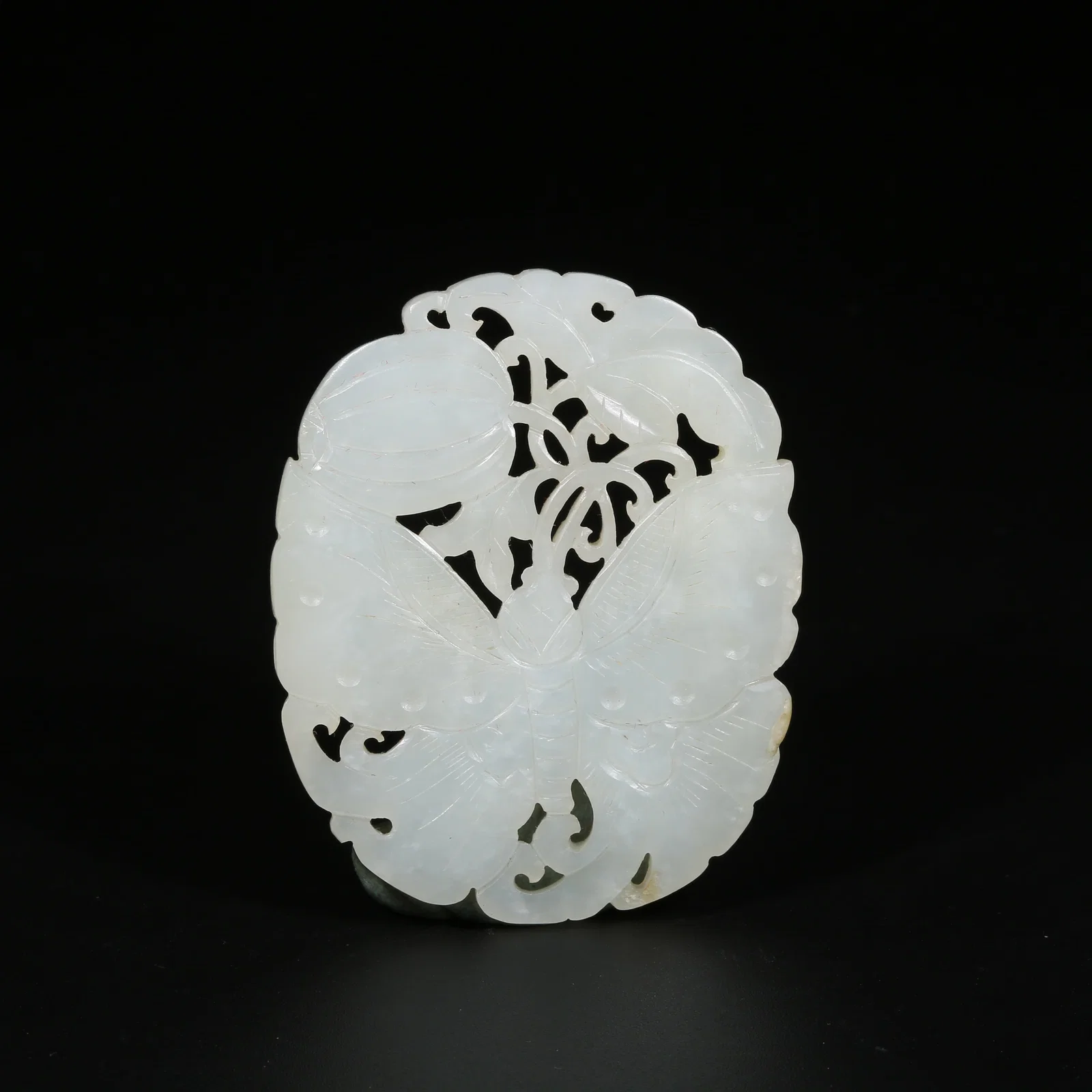 A HETIAN WHITE JADE PENDANT WITH GUA DIE MIAN MIAN MOTIF