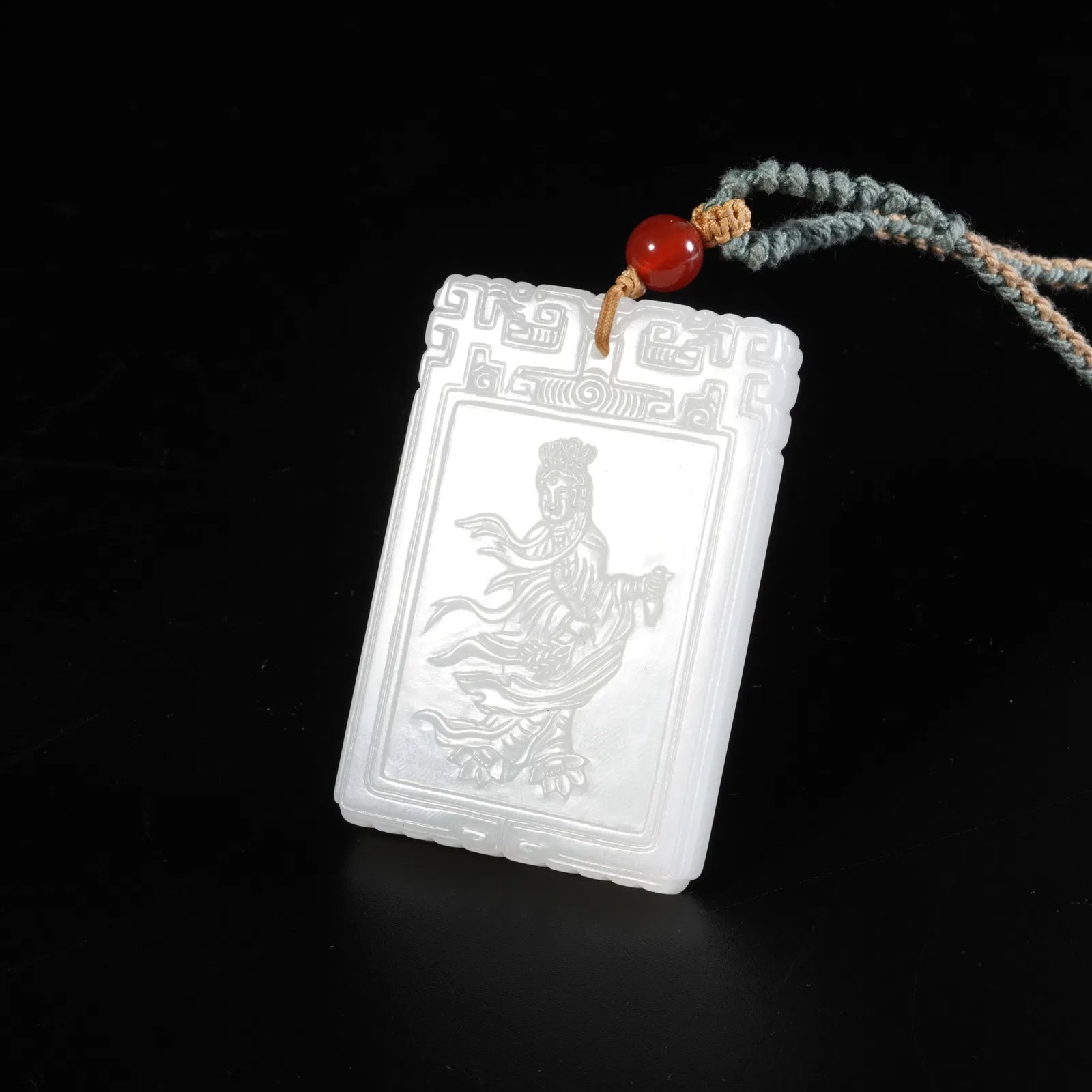 A HETIAN WHITE JADE PLAQUE WITH AVALOKITESHVARA PATTERN