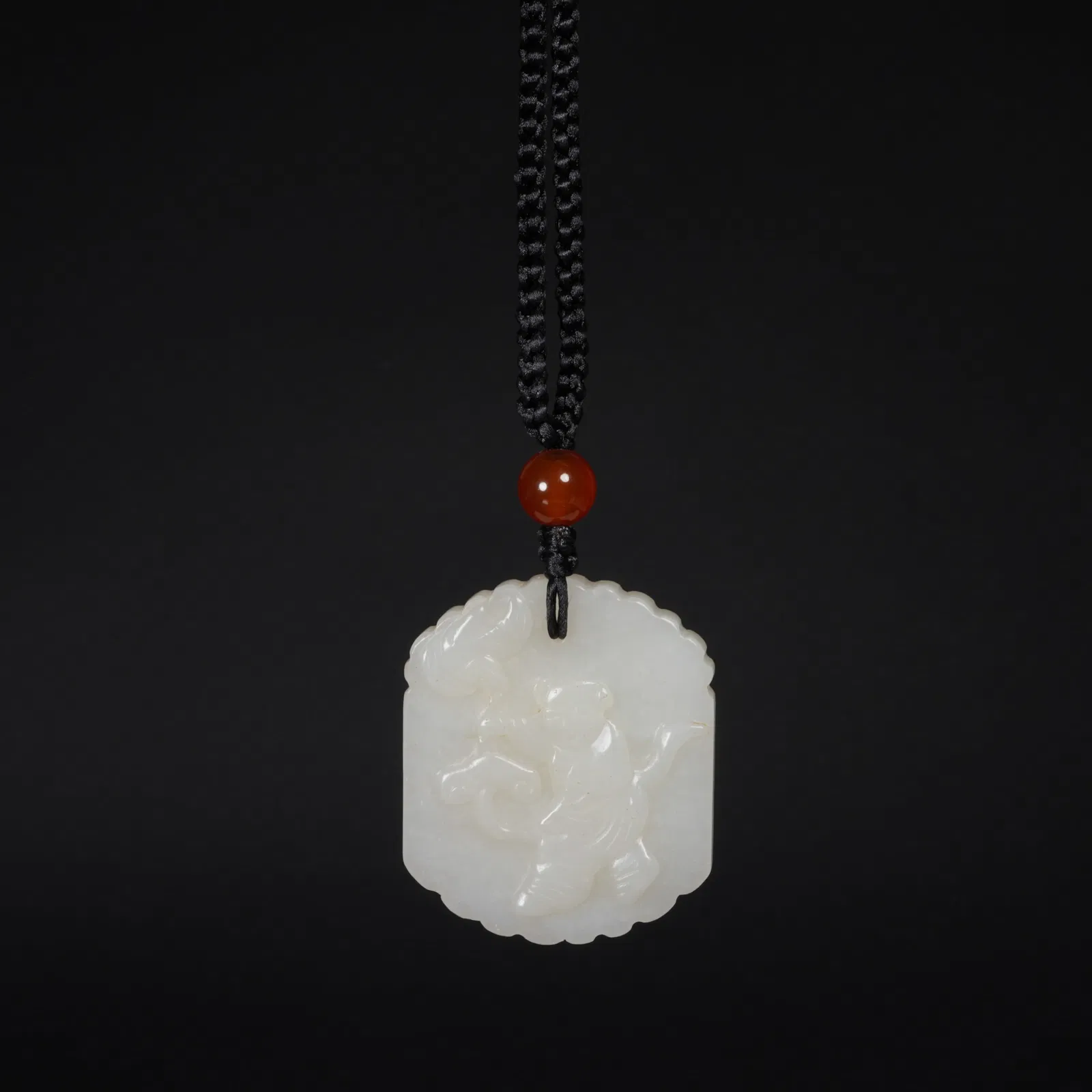 A HETIAN WHITE JADE PLAQUE WITH BOY MOTIF
